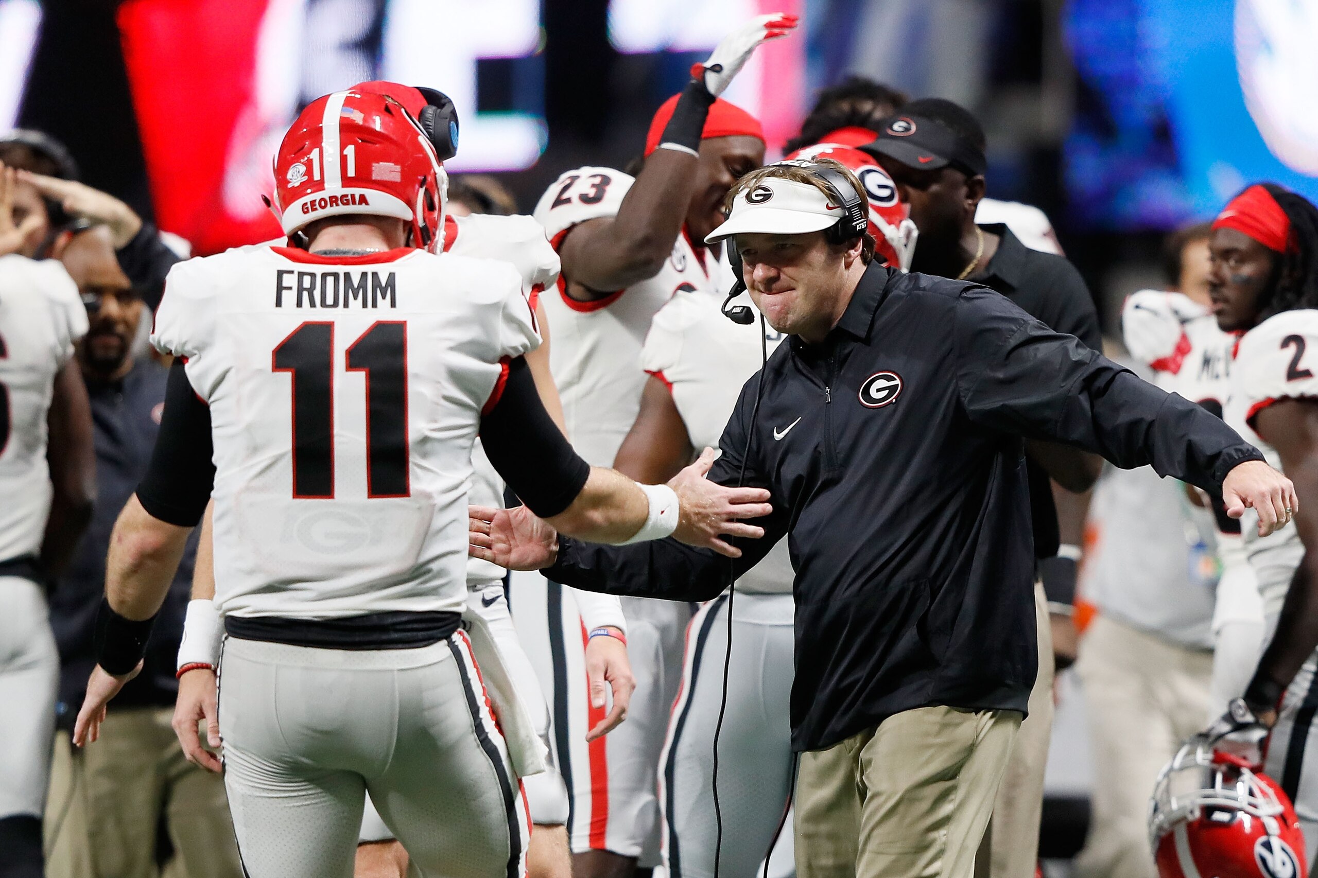 ATLANTA, GA - DECEMBER 02: Head coach Kirby Smart of the Georgia Bulldogs celebrates with Jake Fromm #11 after a touchdown during the second half against the Auburn Tigers in the SEC Championship at Mercedes-Benz Stadium on December 2, 2017 in Atlanta, Ge