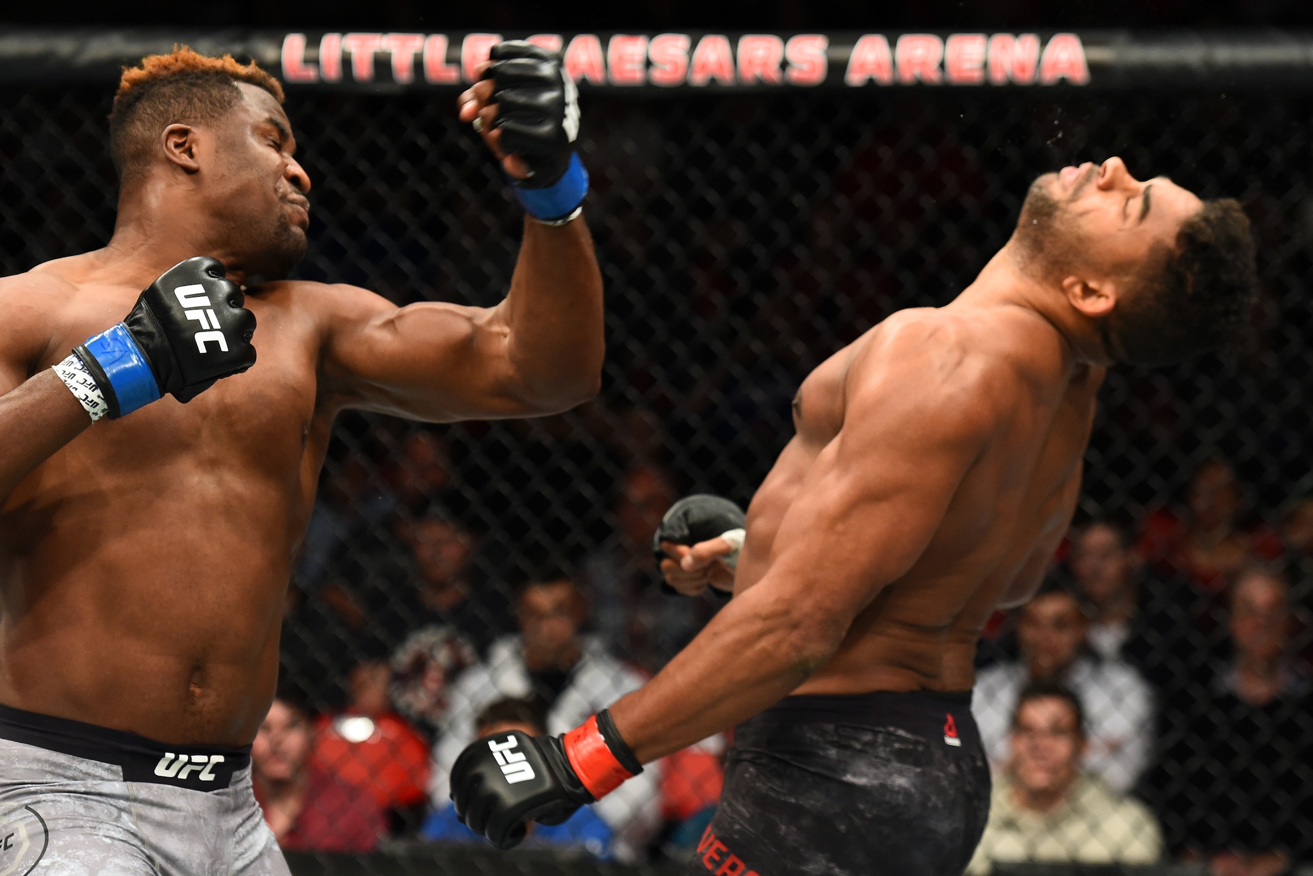 DETROIT, MI - DECEMBER 02:  (L-R) Francis Ngannou of Cameroon punches Alistair Overeem of The Netherlands in their heavyweight bout during the UFC 218 event inside Little Caesars Arena on December 02, 2017 in Detroit, Michigan. (Photo by Josh Hedges/Zuffa