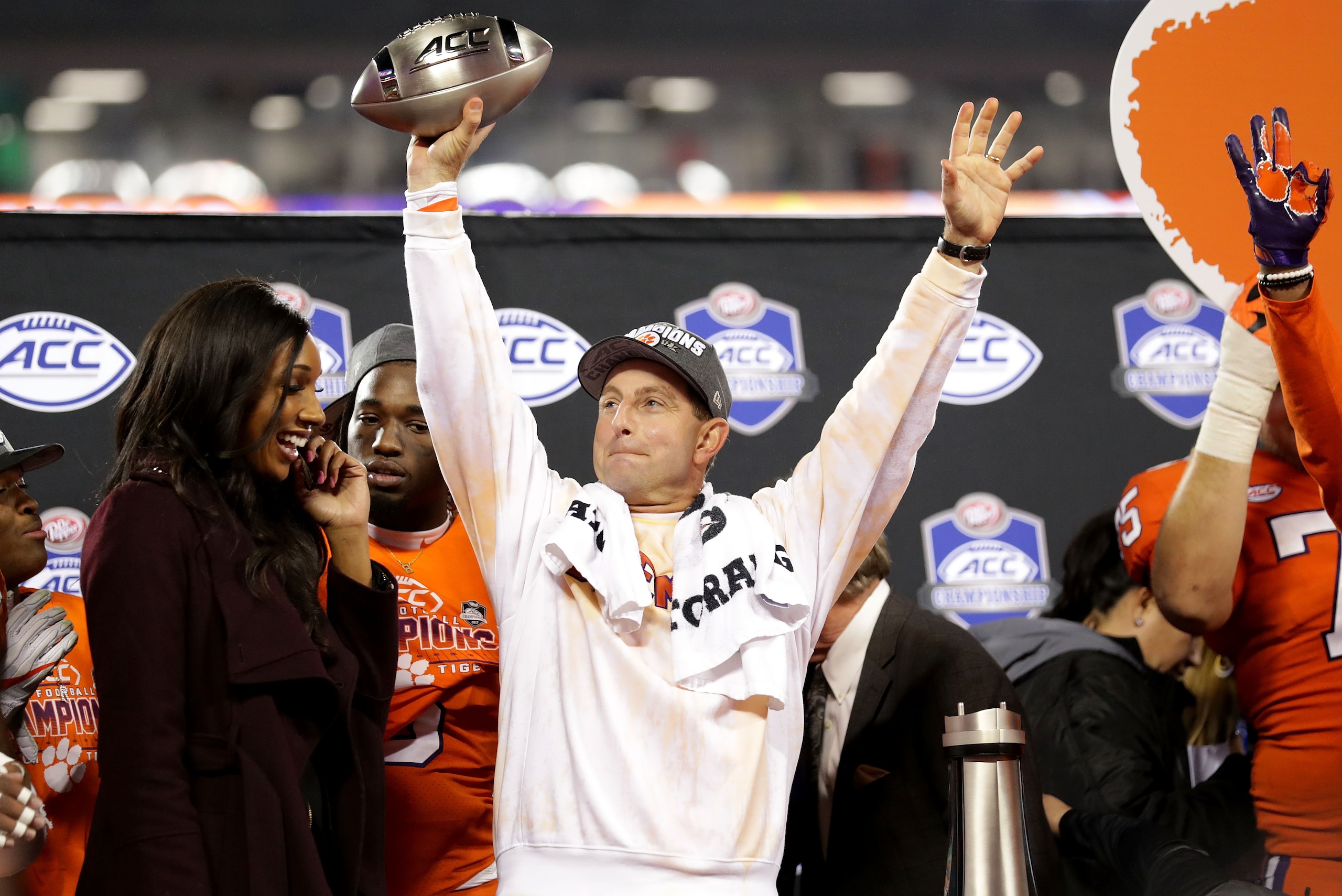 CHARLOTTE, NC - DECEMBER 02:  Head coach Dabo Swinney of the Clemson Tigers celebrates with the trophy after defeating the Miami Hurricanes 38-3 in the ACC Football Championship at Bank of America Stadium on December 2, 2017 in Charlotte, North Carolina. 