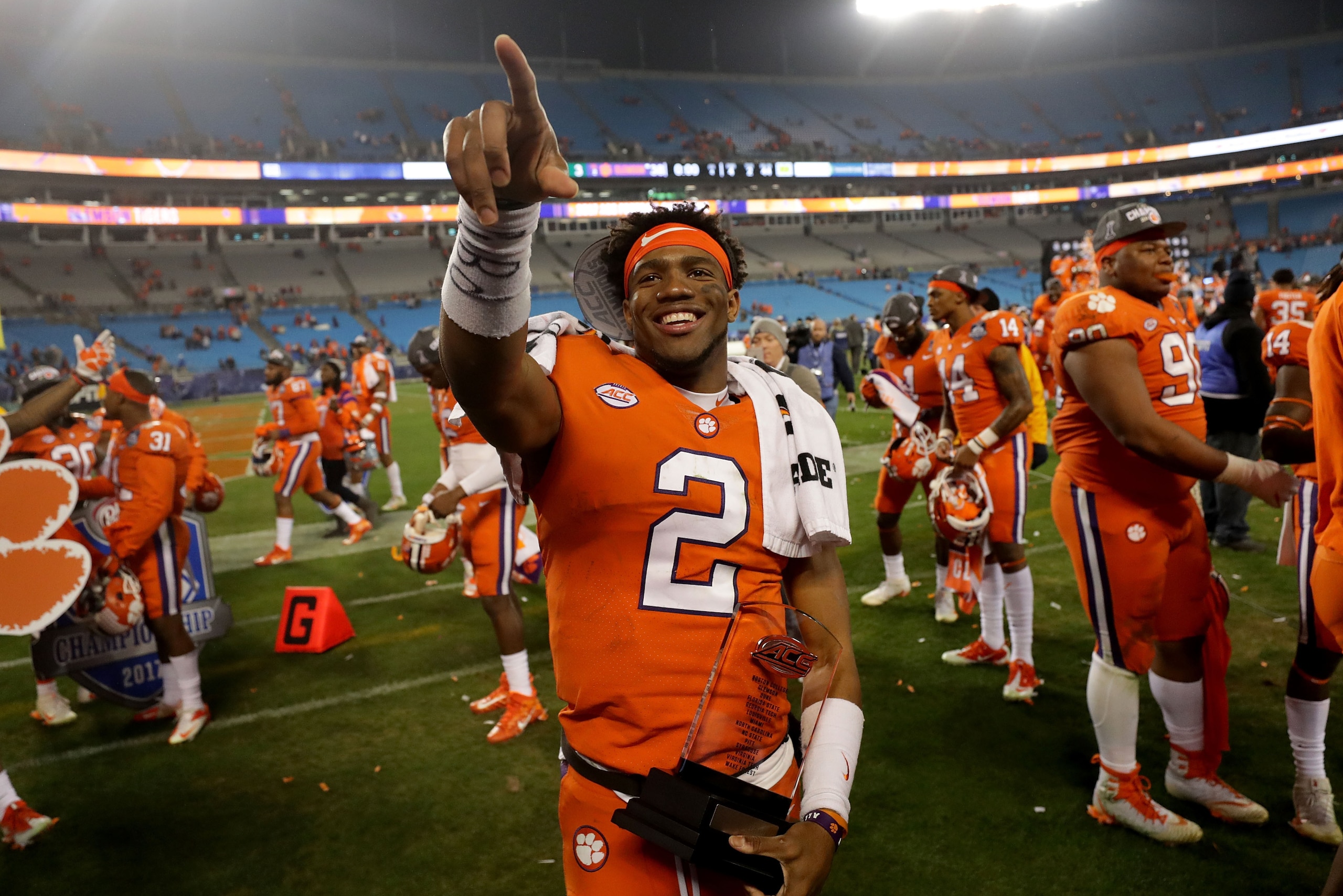 CHARLOTTE, NC - DECEMBER 02:  Kelly Bryant #2 of the Clemson Tigers celebrates with the MVP trophy after defeating the Miami Hurricanes 38-3 in the ACC Football Championship at Bank of America Stadium on December 2, 2017 in Charlotte, North Carolina.  (Ph