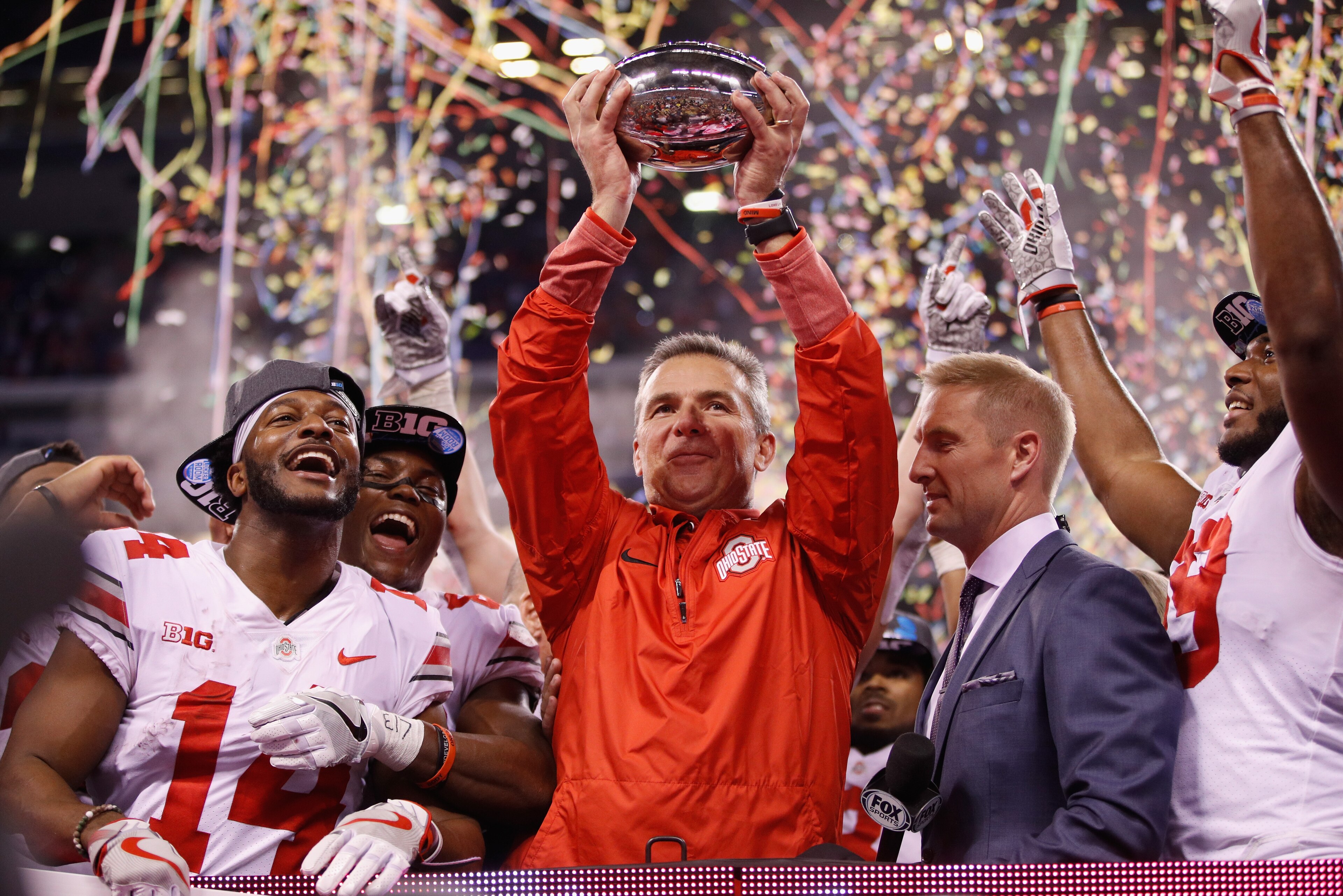INDIANAPOLIS, IN - DECEMBER 02:  Head coach Urban Meyer of the Ohio State Buckeyes celebrates with the trophy after their 27-21 win over the Wisconsin Badgers during the Big Ten Championship game at Lucas Oil Stadium on December 2, 2017 in Indianapolis, I