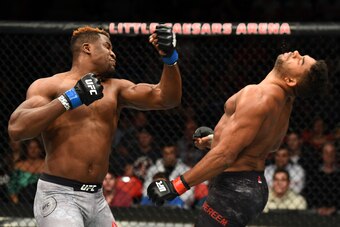 DETROIT, MI - DECEMBER 02:  (L-R) Francis Ngannou of Cameroon punches Alistair Overeem of The Netherlands in their heavyweight bout during the UFC 218 event inside Little Caesars Arena on December 02, 2017 in Detroit, Michigan. (Photo by Josh Hedges/Zuffa