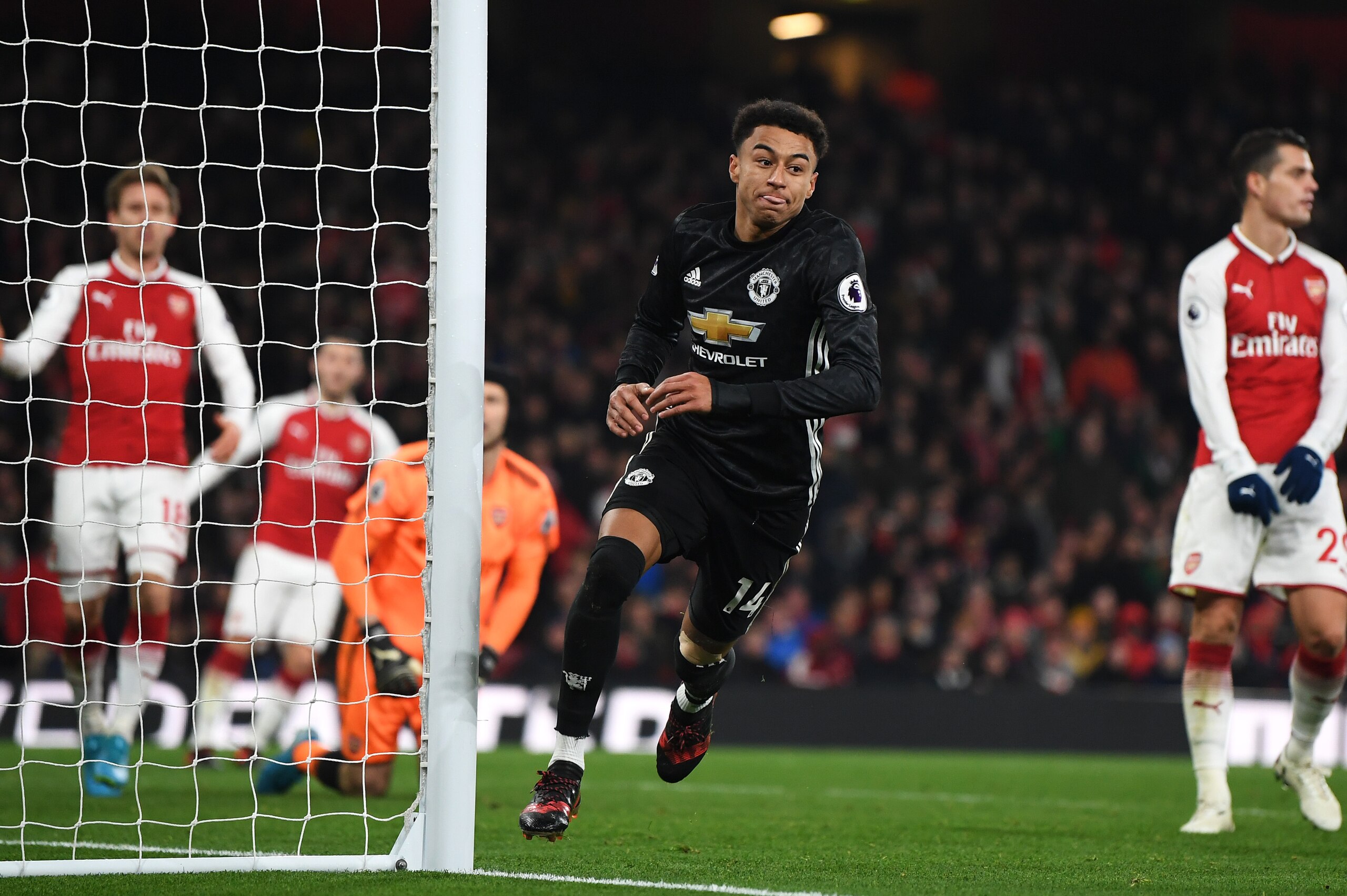 LONDON, ENGLAND - DECEMBER 02: Jesse Lingard of Manchester United celebrates after scoring his sides third goal during the Premier League match between Arsenal and Manchester United at Emirates Stadium on December 2, 2017 in London, England.  (Photo by La