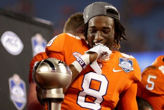 CHARLOTTE, NC - DECEMBER 02:  Deon Cain #8 of the Clemson Tigers reacts to seeing the trophy after the ACC Football Championship at Bank of America Stadium on December 2, 2017 in Charlotte, North Carolina.  (Photo by Streeter Lecka/Getty Images)