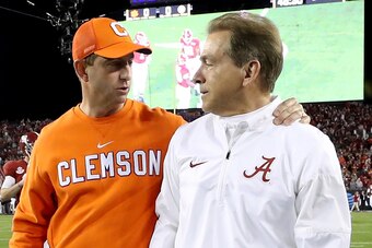 TAMPA, FL - JANUARY 09:  Head coach Dabo Swinney of the Clemson Tigers (L) talks with Head coach Nick Saban of the Alabama Crimson Tide prior to the 2017 College Football Playoff National Championship Game at Raymond James Stadium on January 9, 2017 in Ta