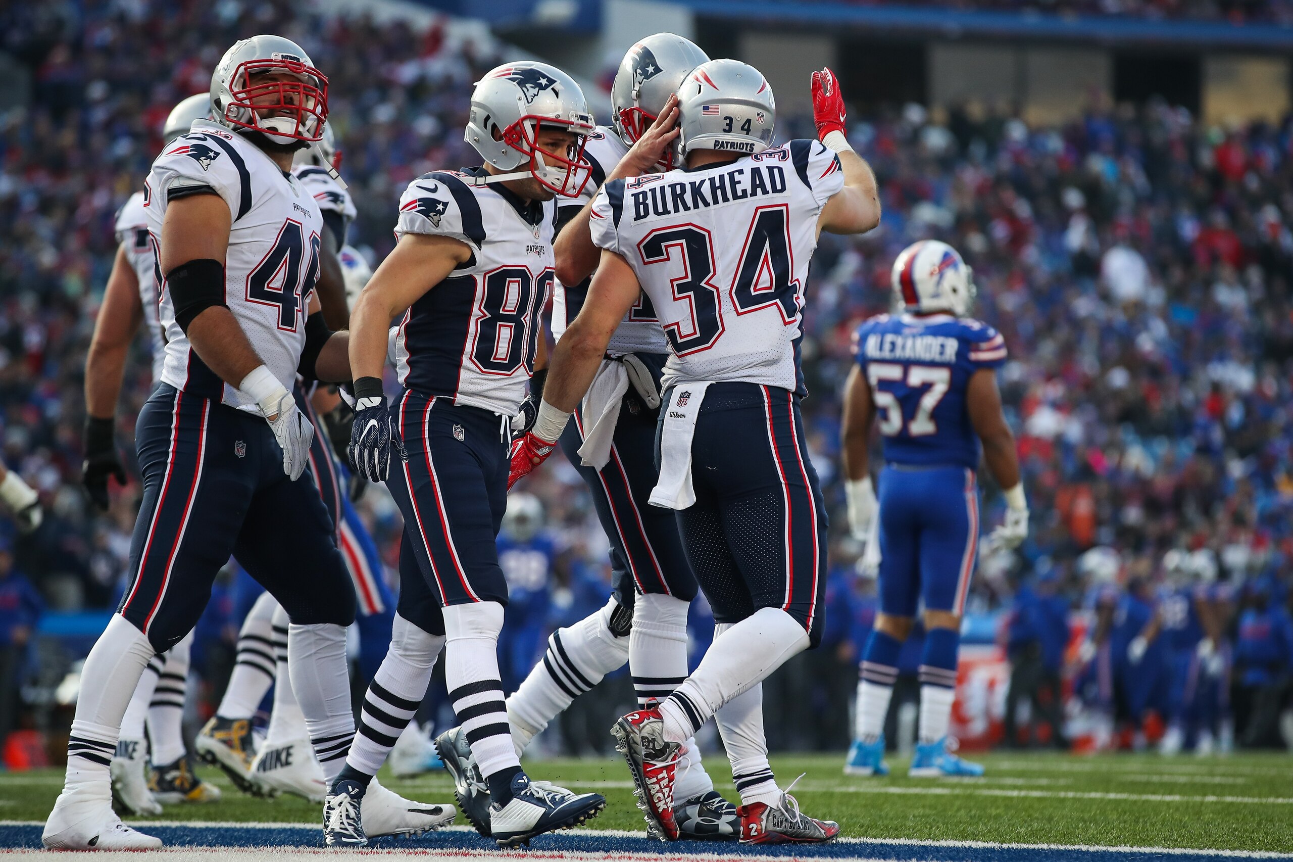 ORCHARD PARK, NY - DECEMBER 3: Rex Burkhead #34 of the New England Patriots celebrates with teammates after scoring a touchdown during the third quarter against the Buffalo Bills on December 3, 2017 at New Era Field in Orchard Park, New York. (Photo by ORCHARD PARK, NY - DECEMBER 3: Rex Burkhead #34 of the New England Patriots celebrates with teammates after scoring a touchdown during the third quarter against the Buffalo Bills on December 3, 2017 at New Era Field in Orchard Park, New York. (Photo by