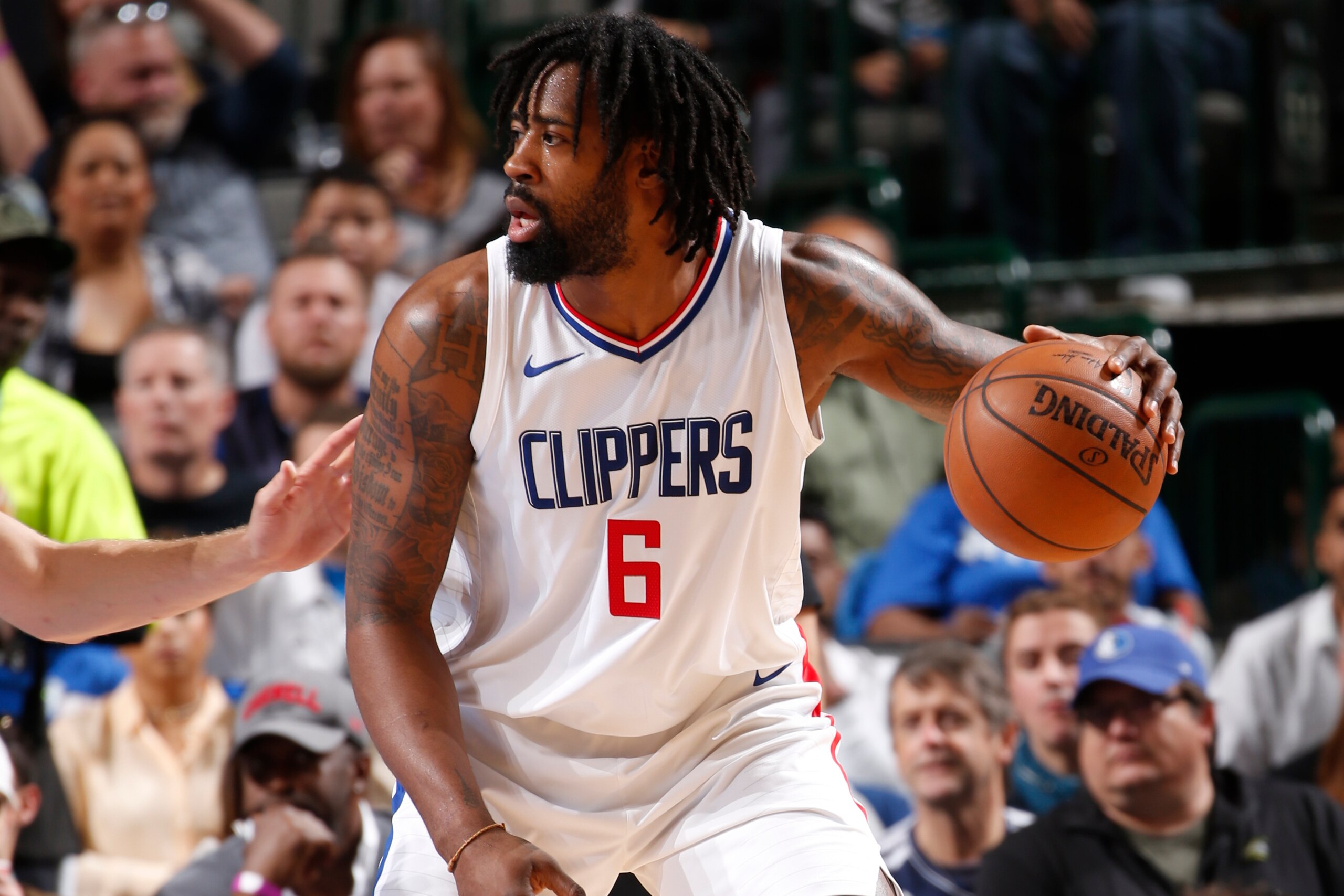 DALLAS, TX - DECEMBER 2: DeAndre Jordan #6 of the LA Clippers handles the ball against the Dallas Mavericks on December 2, 2017 at the American Airlines Center in Dallas, Texas. NOTE TO USER: User expressly acknowledges and agrees that, by downloading and