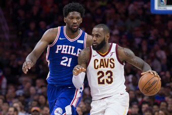 PHILADELPHIA, PA - NOVEMBER 27: LeBron James #23 of the Cleveland Cavaliers dribbles the ball against Joel Embiid #21 of the Philadelphia 76ers at the Wells Fargo Center on November 27, 2017 in Philadelphia, Pennsylvania. NOTE TO USER: User expressly ackn