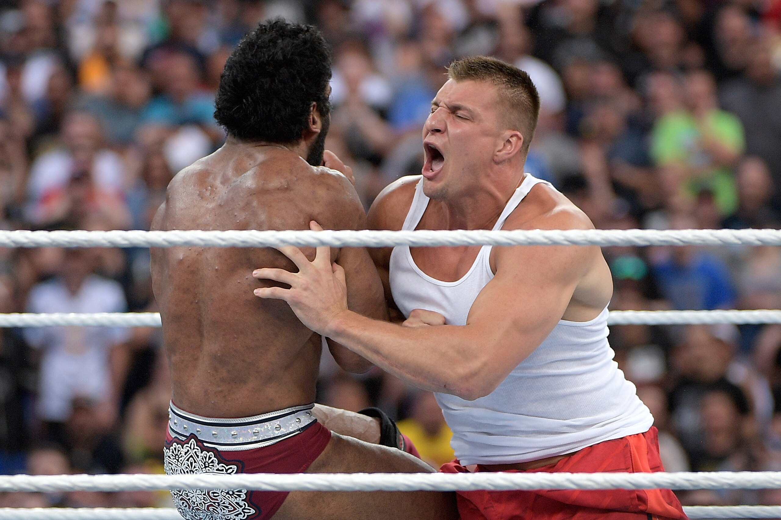 New England Patriots tight end Rob Gronkowski slams into WWE superstar Jinder Mahal at Wrestlemania 33. New England Patriots tight end Rob Gronkowski slams into WWE superstar Jinder Mahal at Wrestlemania 33.