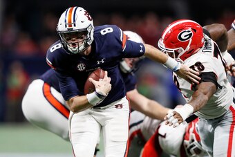 ATLANTA, GA - DECEMBER 02: Jarrett Stidham #8 of the Auburn Tigers runs the ball during the second half against the Georgia Bulldogs in the SEC Championship at Mercedes-Benz Stadium on December 2, 2017 in Atlanta, Georgia. (Photo by Jamie Squire/Getty Ima