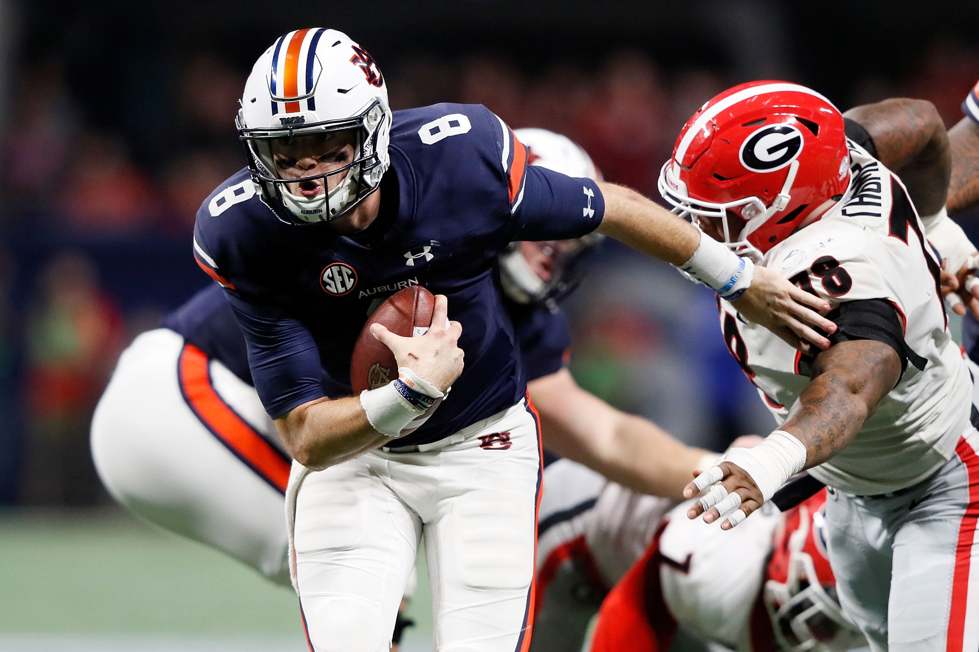 ATLANTA, GA - DECEMBER 02: Jarrett Stidham #8 of the Auburn Tigers runs the ball during the second half against the Georgia Bulldogs in the SEC Championship at Mercedes-Benz Stadium on December 2, 2017 in Atlanta, Georgia. (Photo by Jamie Squire/Getty Ima ATLANTA, GA - DECEMBER 02: Jarrett Stidham #8 of the Auburn Tigers runs the ball during the second half against the Georgia Bulldogs in the SEC Championship at Mercedes-Benz Stadium on December 2, 2017 in Atlanta, Georgia. (Photo by Jamie Squire/Getty Ima