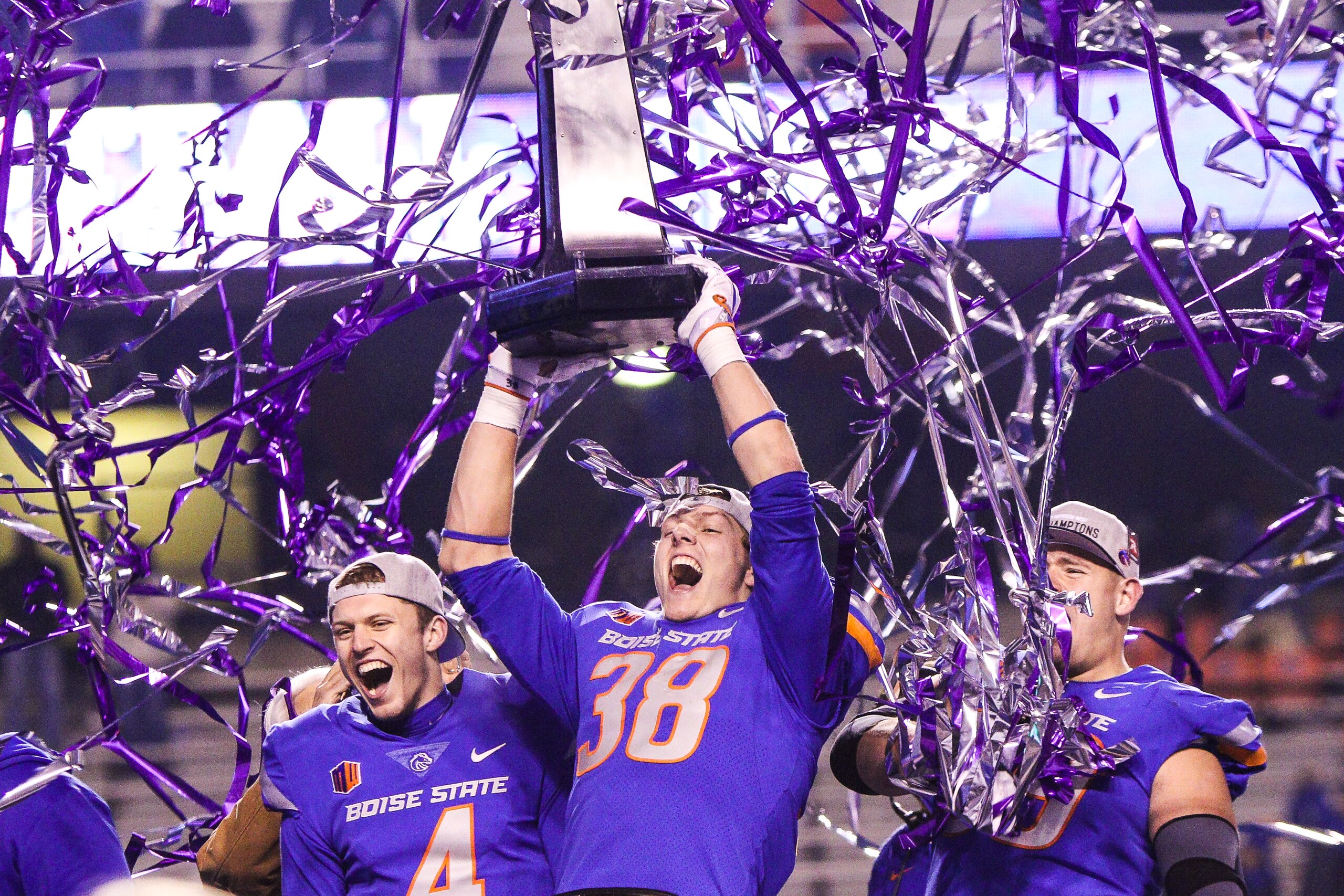 BOISE, ID - DECEMBER 2: Linebacker Leighton Vander Esch #38 and quarterback Brett Rypien #4 of the Boise State Broncos hoist the championship trophy at the conclusion of the Mountain West Championship game against the Fresno State Bulldogs on December 2, 