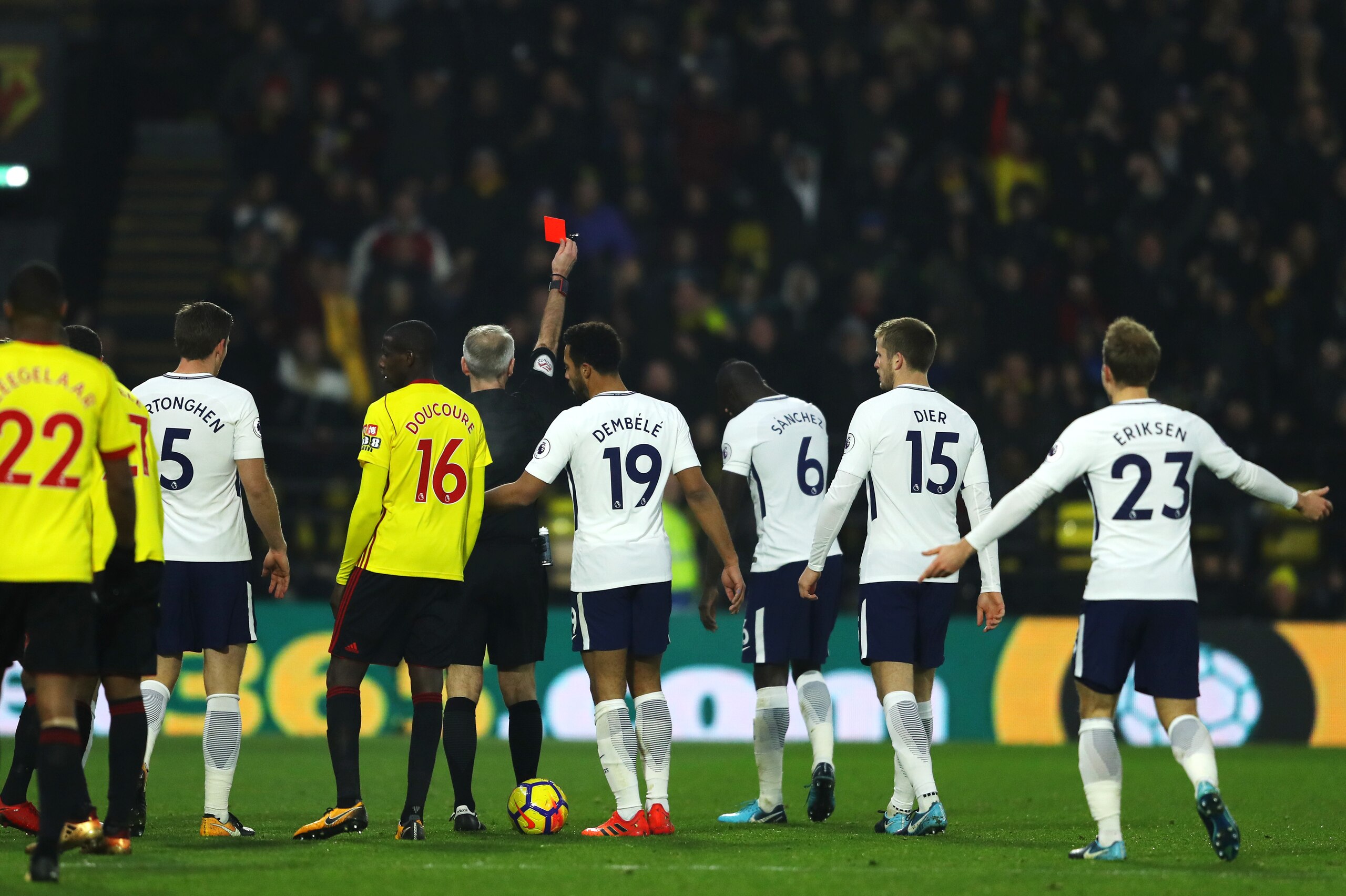 WATFORD, ENGLAND - DECEMBER 02:  Davinson Sanchez of Tottenham Hotspur is shown a red card by referee Martin Atkinson during the Premier League match between Watford and Tottenham Hotspur at Vicarage Road on December 2, 2017 in Watford, England.  (Photo b