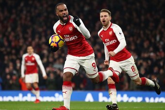LONDON, ENGLAND - DECEMBER 02:  Alexandre Lacazette of Arsenal celebrates scoring his teams first goal past David De Gea of Manchester United to make it 2-1 during the Premier League match between Arsenal and Manchester United at Emirates Stadium on Decem