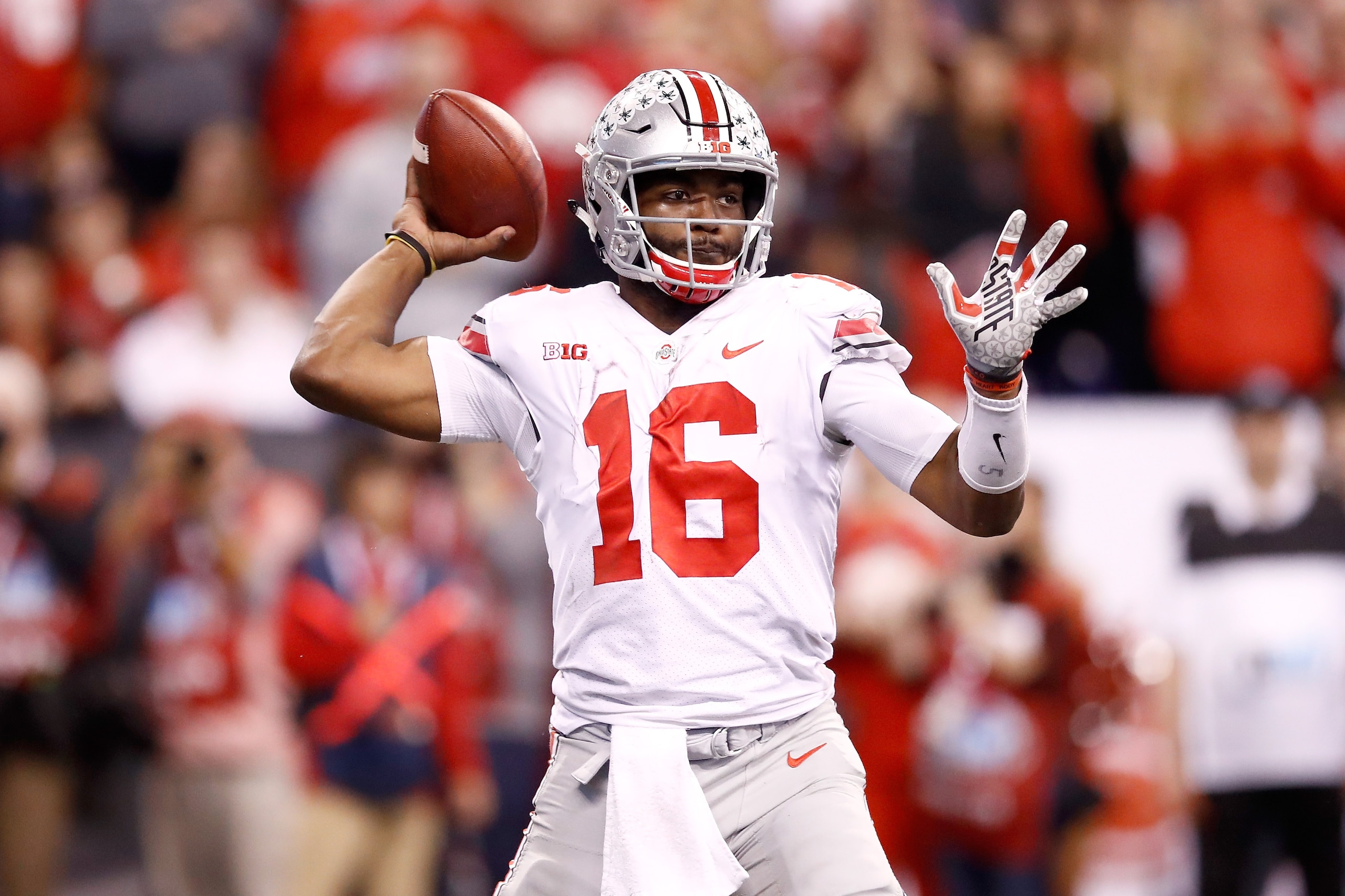 INDIANAPOLIS, IN - DECEMBER 02: J.T. Barrett #16 of the Ohio State Buckeyes throws a pass against the Wisconsin Badgers in the Big Ten Championship at Lucas Oil Stadium on December 2, 2017 in Indianapolis, Indiana. Ohio State won 27-21. (Photo by Andy INDIANAPOLIS, IN - DECEMBER 02: J.T. Barrett #16 of the Ohio State Buckeyes throws a pass against the Wisconsin Badgers in the Big Ten Championship at Lucas Oil Stadium on December 2, 2017 in Indianapolis, Indiana. Ohio State won 27-21. (Photo by Andy