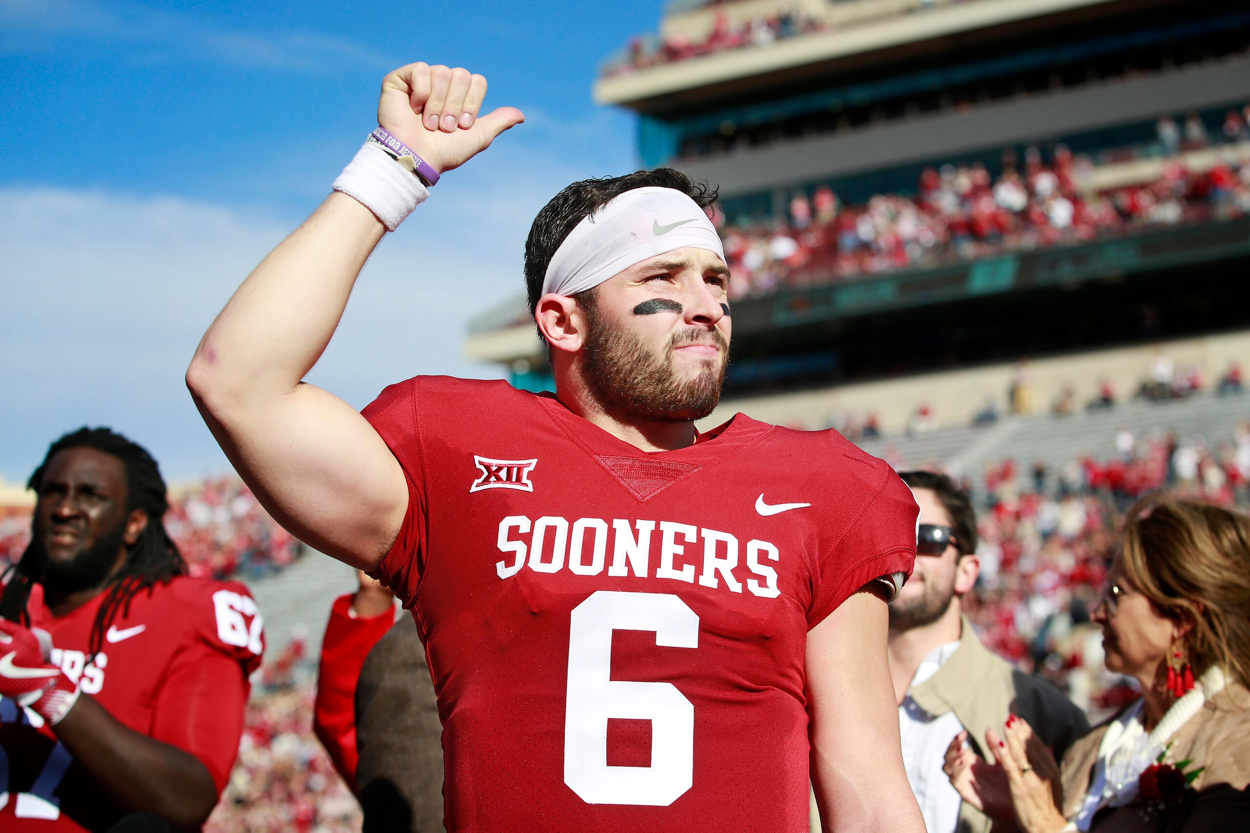 NORMAN, OK - NOVEMBER 25: Quarterback Baker Mayfield #6 of the Oklahoma Sooners gestures to the crowd after Senior Day announcements before the game against the West Virginia Mountaineers at Gaylord Family Oklahoma Memorial Stadium on November 25, 2017 in NORMAN, OK - NOVEMBER 25: Quarterback Baker Mayfield #6 of the Oklahoma Sooners gestures to the crowd after Senior Day announcements before the game against the West Virginia Mountaineers at Gaylord Family Oklahoma Memorial Stadium on November 25, 2017 in