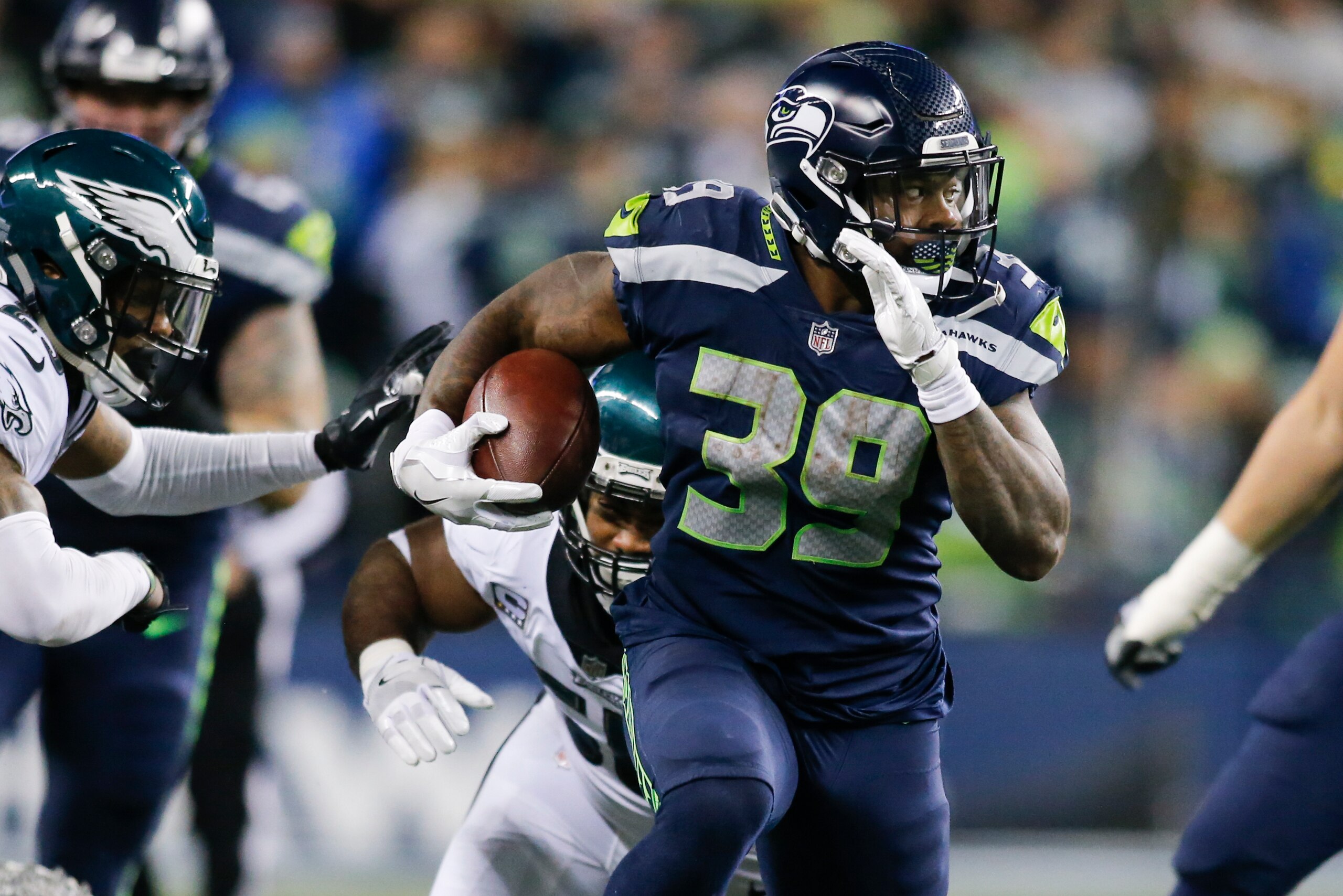 SEATTLE, WA - DECEMBER 03: Running back Mike Davis #39 of the Seattle Seahawks rushes against the Philadelphia Eagles in the fourth quarter at CenturyLink Field on December 3, 2017 in Seattle, Washington. (Photo by Jonathan Ferrey/Getty Images)