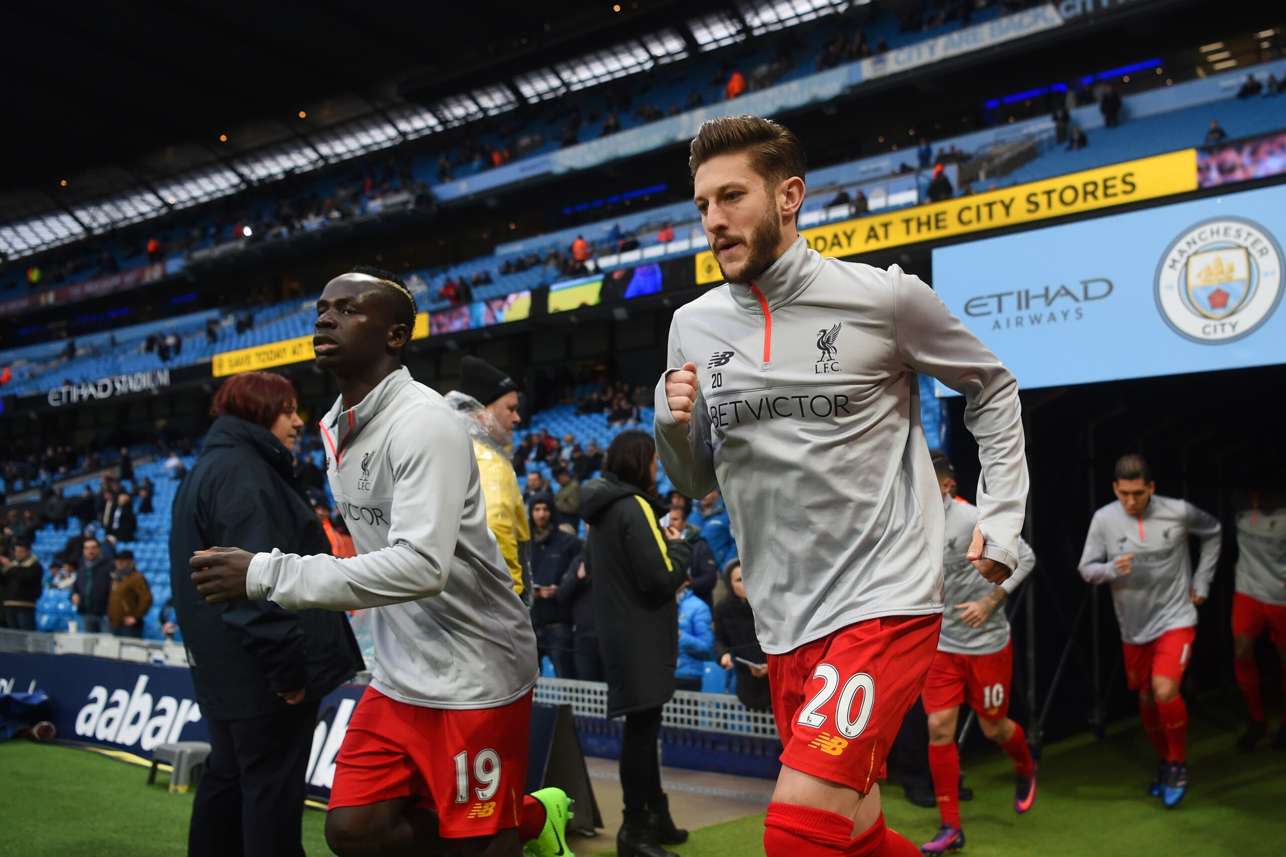 MANCHESTER, ENGLAND - MARCH 19: Sadio Mane of Liverpool (L) and Adam Lallana of Liverpool (R) come out of the tunnel to warm up prior to the Premier League match between Manchester City and Liverpool at Etihad Stadium on March 19, 2017 in Manchester, Engl MANCHESTER, ENGLAND - MARCH 19: Sadio Mane of Liverpool (L) and Adam Lallana of Liverpool (R) come out of the tunnel to warm up prior to the Premier League match between Manchester City and Liverpool at Etihad Stadium on March 19, 2017 in Manchester, Engl