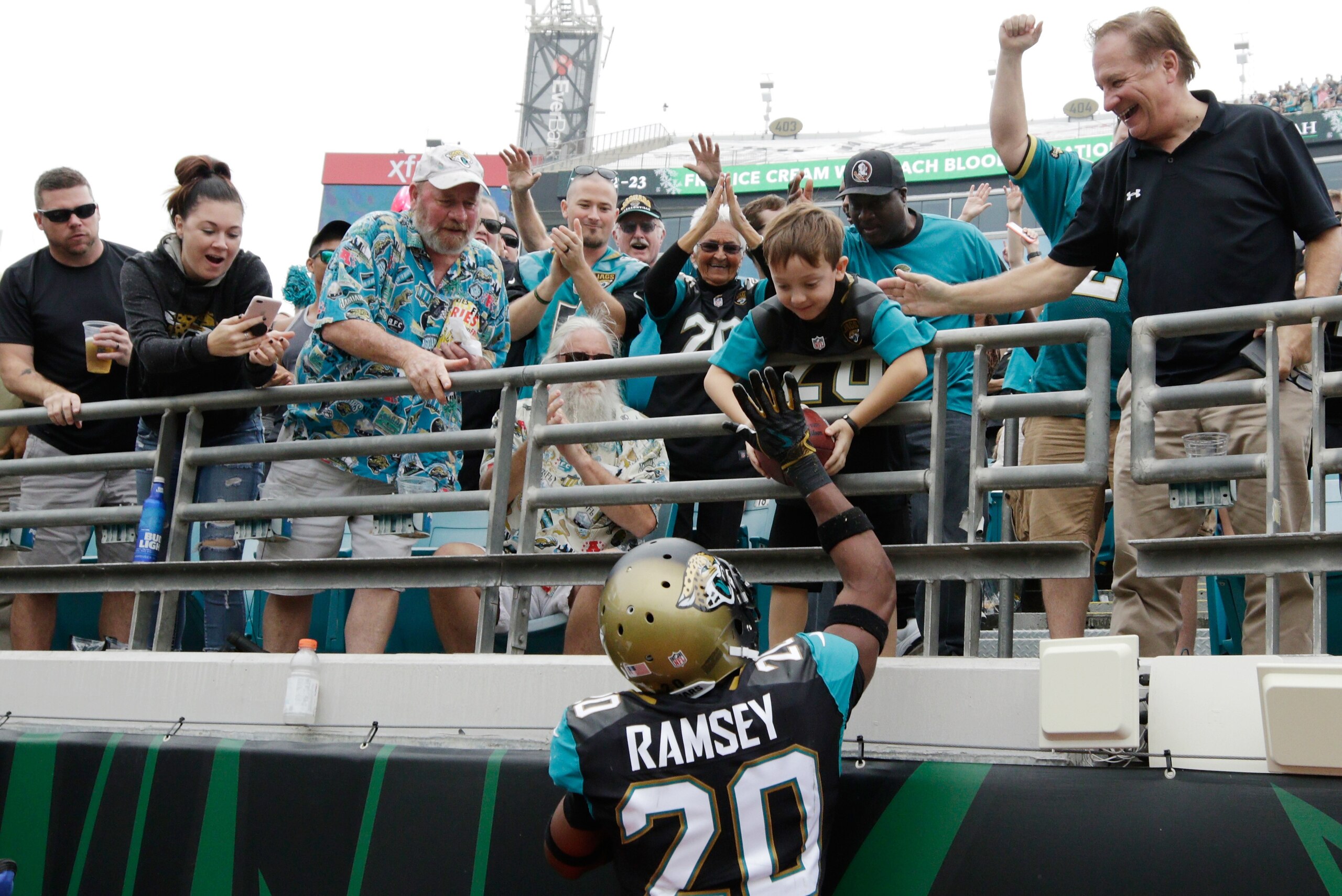 JACKSONVILLE, FL - DECEMBER 03:  Jalen Ramsey #20 of the Jacksonville Jaguars give a football to a young fan after Ramsey had an interception in the first half of their game against the Indianapolis Colts at EverBank Field on December 3, 2017 in Jacksonvi