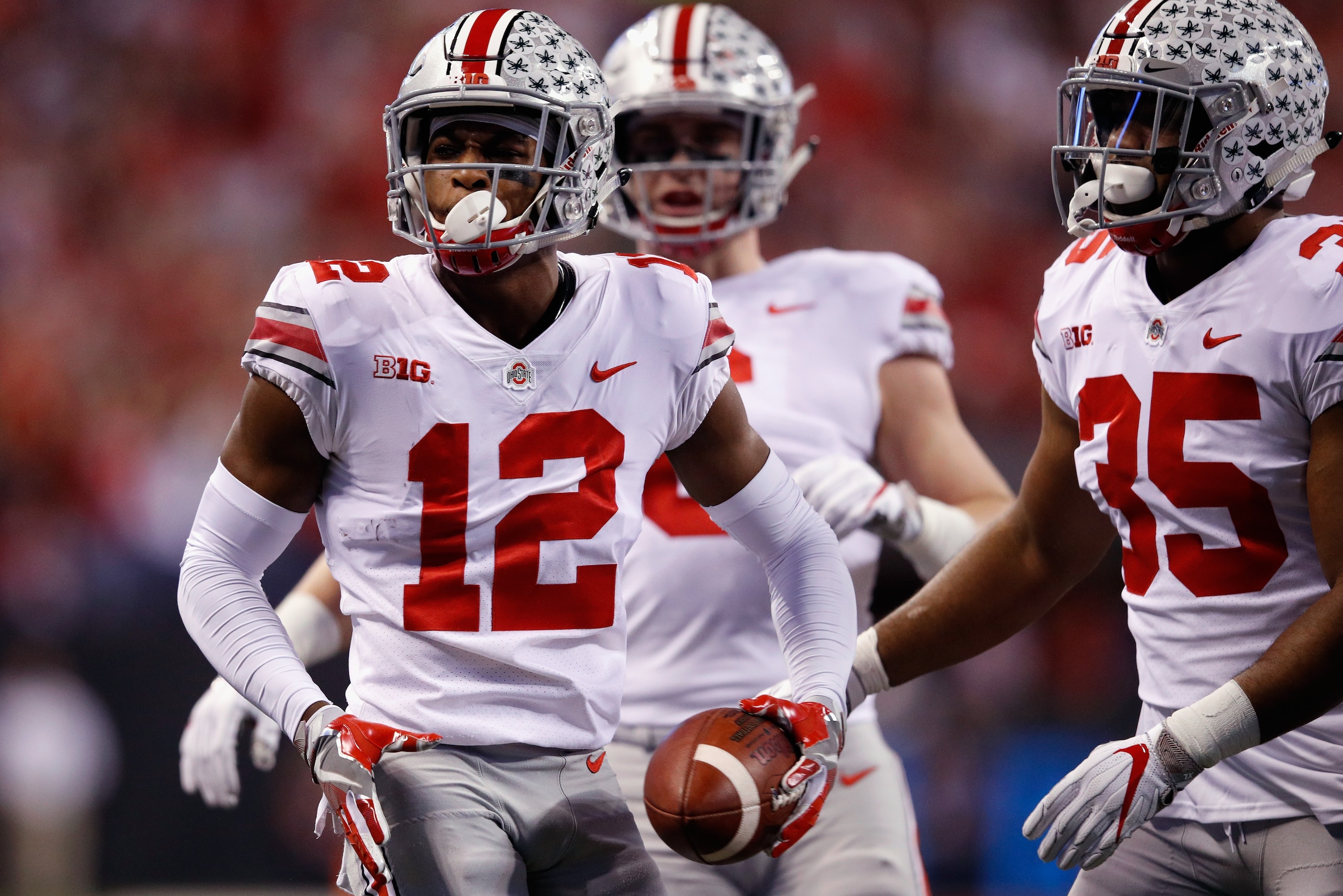 INDIANAPOLIS, IN - DECEMBER 02:  Denzel Ward #12 of the Ohio State Buckeyes celebrates an interception against the Ohio State Buckeyes in the first half during the Big Ten Championship game at Lucas Oil Stadium on December 2, 2017 in Indianapolis, Indiana