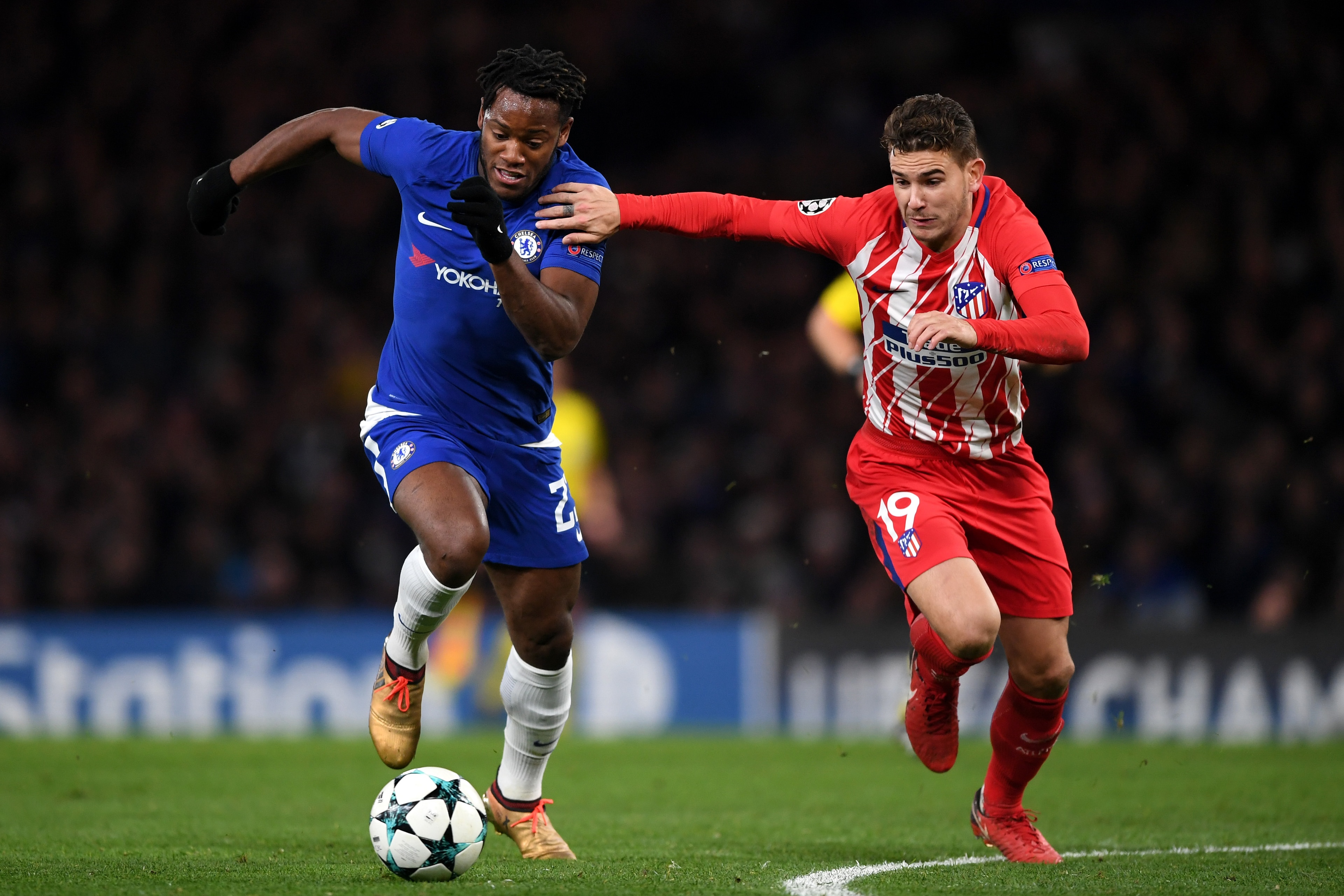 LONDON, ENGLAND - DECEMBER 05:  Michy Batshuayi of Chelsea is challenged by Lucas Hernandez of Atletico Madrid during the UEFA Champions League group C match between Chelsea FC and Atletico Madrid at Stamford Bridge on December 5, 2017 in London, United K