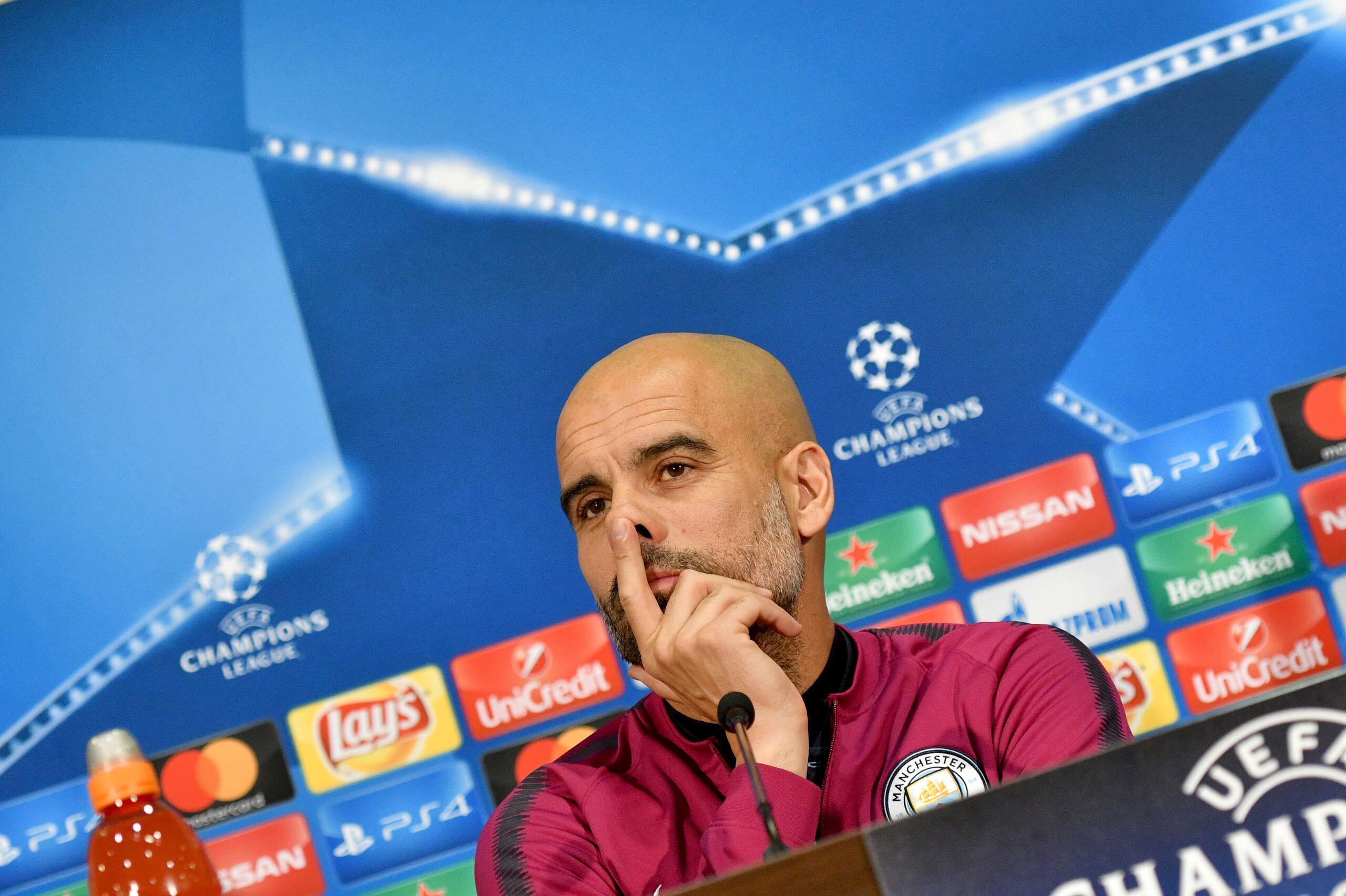 Manchester City's Spanish head coach Pep Guardiola listens to journalists during a press conference in Kharkiv on December 5, 2017, on the eve of the UEFA Champion League Group F football match against Shakhtar Donetsk. / AFP PHOTO / GENYA SAVILOV        