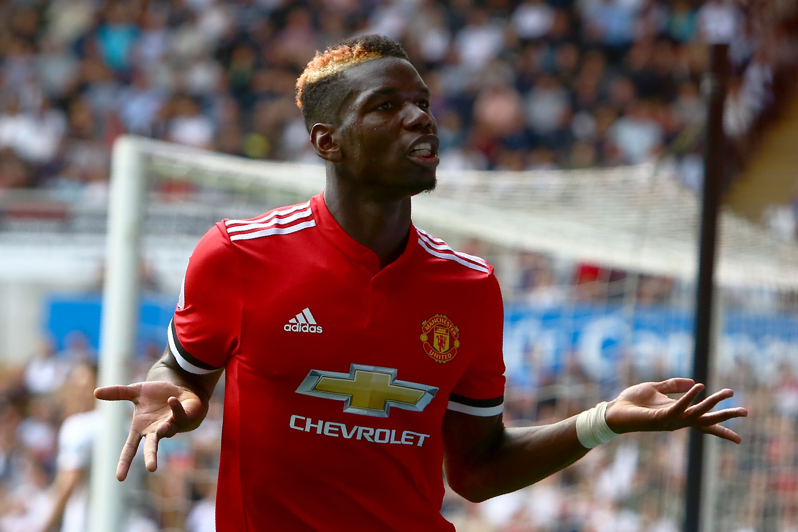Manchester United's French midfielder Paul Pogba celebrates scoring the team's fourth goal during the English Premier League football match between Swansea City and Manchester United at The Liberty Stadium in Swansea, south Wales on August 19, 2017. / AFP