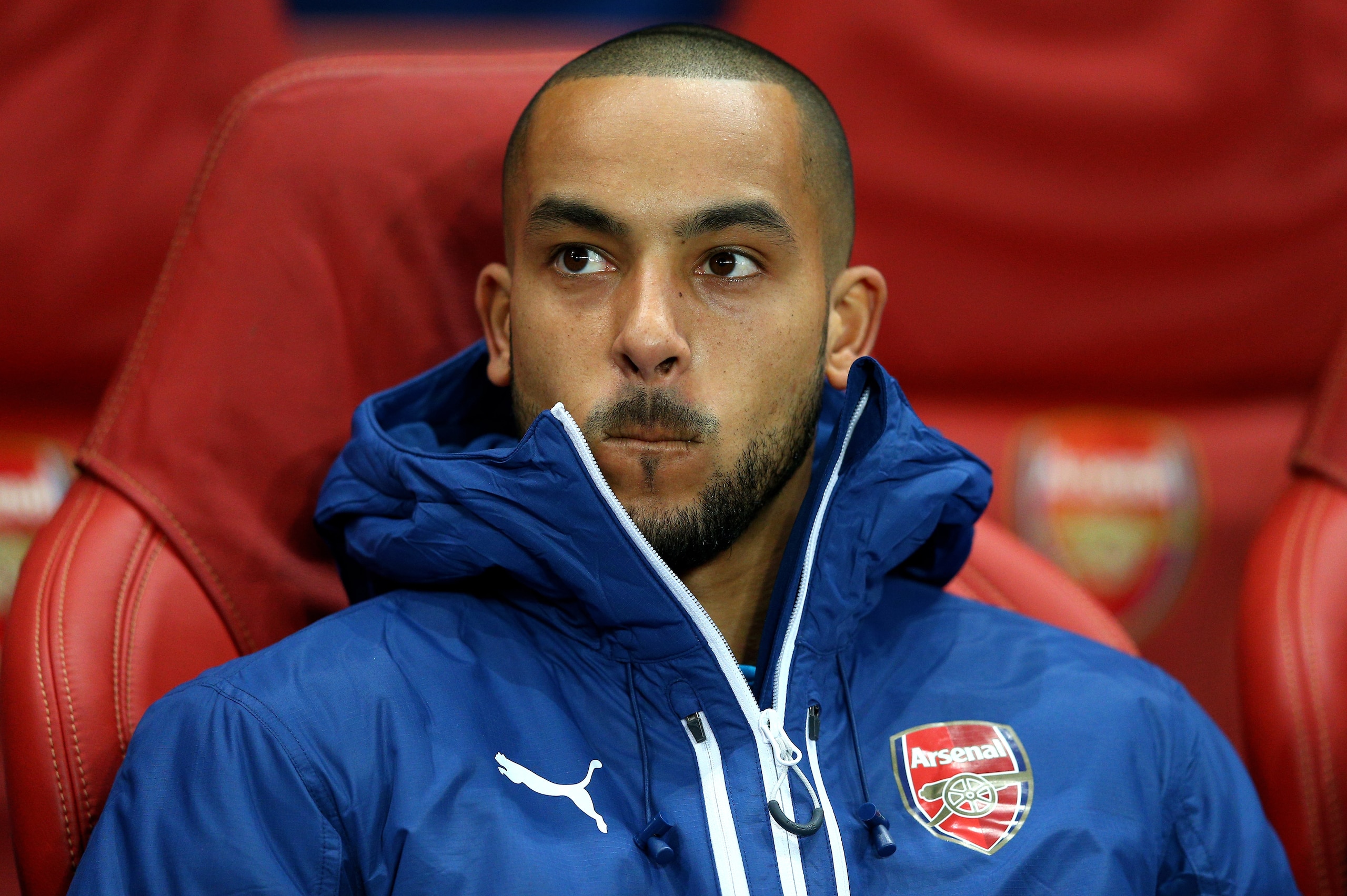 LONDON, ENGLAND - FEBRUARY 25:  Theo Walcott of Arsenal looks on from the substitutes bench during the UEFA Champions League round of 16, first leg match between Arsenal and Monaco at The Emirates Stadium on February 25, 2015 in London, United Kingdom.  (