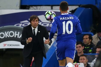 LONDON, ENGLAND - MAY 15: Antonio Conte manager / head coach of Chelsea throws the ball to Eden Hazard of Chelsea during the Premier League match between Chelsea and Watford at Stamford Bridge on May 15, 2017 in London, England. (Photo by Catherine Ivill 