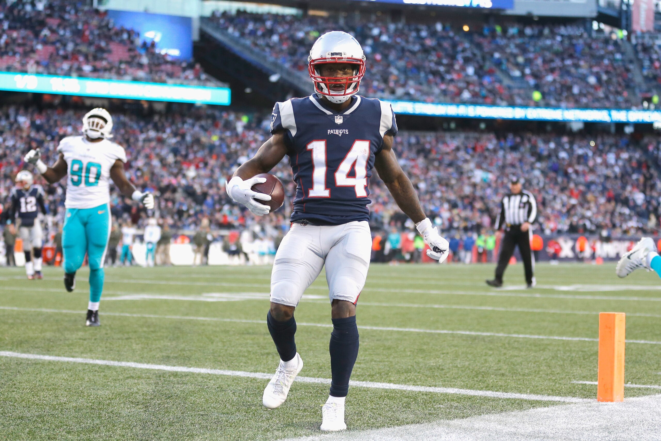 FOXBORO, MA - NOVEMBER 26: Brandin Cooks #14 of the New England Patriots reacts after scoring a touchdown during the fourth quarter of a game against the Miami Dolphins at Gillette Stadium on November 26, 2017 in Foxboro, Massachusetts. (Photo by Jim Roga