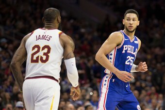 PHILADELPHIA, PA - NOVEMBER 27: LeBron James #23 of the Cleveland Cavaliers in action along with Ben Simmons #25 of the Philadelphia 76ers at the Wells Fargo Center on November 27, 2017 in Philadelphia, Pennsylvania. NOTE TO USER: User expressly acknowled