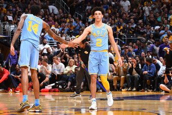 LOS ANGELES, CA - OCTOBER 25:  Brandon Ingram #14 and Lonzo Ball #2 of the Los Angeles Lakers shake hands against the Washington Wizards on October 25, 2017 at STAPLES Center in Los Angeles, California. NOTE TO USER: User expressly acknowledges and agrees