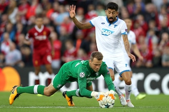 LIVERPOOL, ENGLAND - AUGUST 23:  Simon Mignolet of Liverpool collects the ball from Kerem Demirbay of Hoffenheim during the UEFA Champions League Qualifying Play-Offs round second leg match between Liverpool FC and 1899 Hoffenheim at Anfield on August 23,