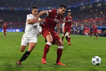 SEVILLE, SPAIN - NOVEMBER 21:  Ganso of Sevilla and Dejan Lovren of Liverpool battle for possession during the UEFA Champions League group E match between Sevilla FC and Liverpool FC at Estadio Ramon Sanchez Pizjuan on November 21, 2017 in Seville, Spain.