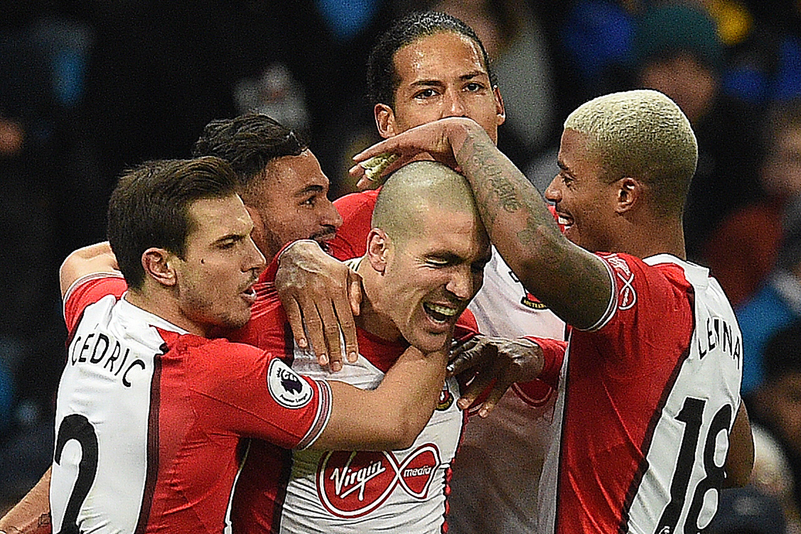 Southampton's Spanish midfielder Oriol Romeu (C) celebrates scoring his team's first goal during the English Premier League football match between Manchester City and Southampton at the Etihad Stadium in Manchester, north west England, on November 29, 201