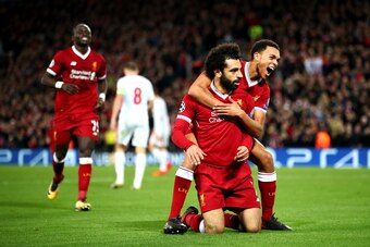 LIVERPOOL, ENGLAND - DECEMBER 06:  Mohamed Salah of Liverpool celebrates after scoring his sides seventh goal with Trent Alex Arnold of Liverpool during the UEFA Champions League group E match between Liverpool FC and Spartak Moskva at Anfield on December