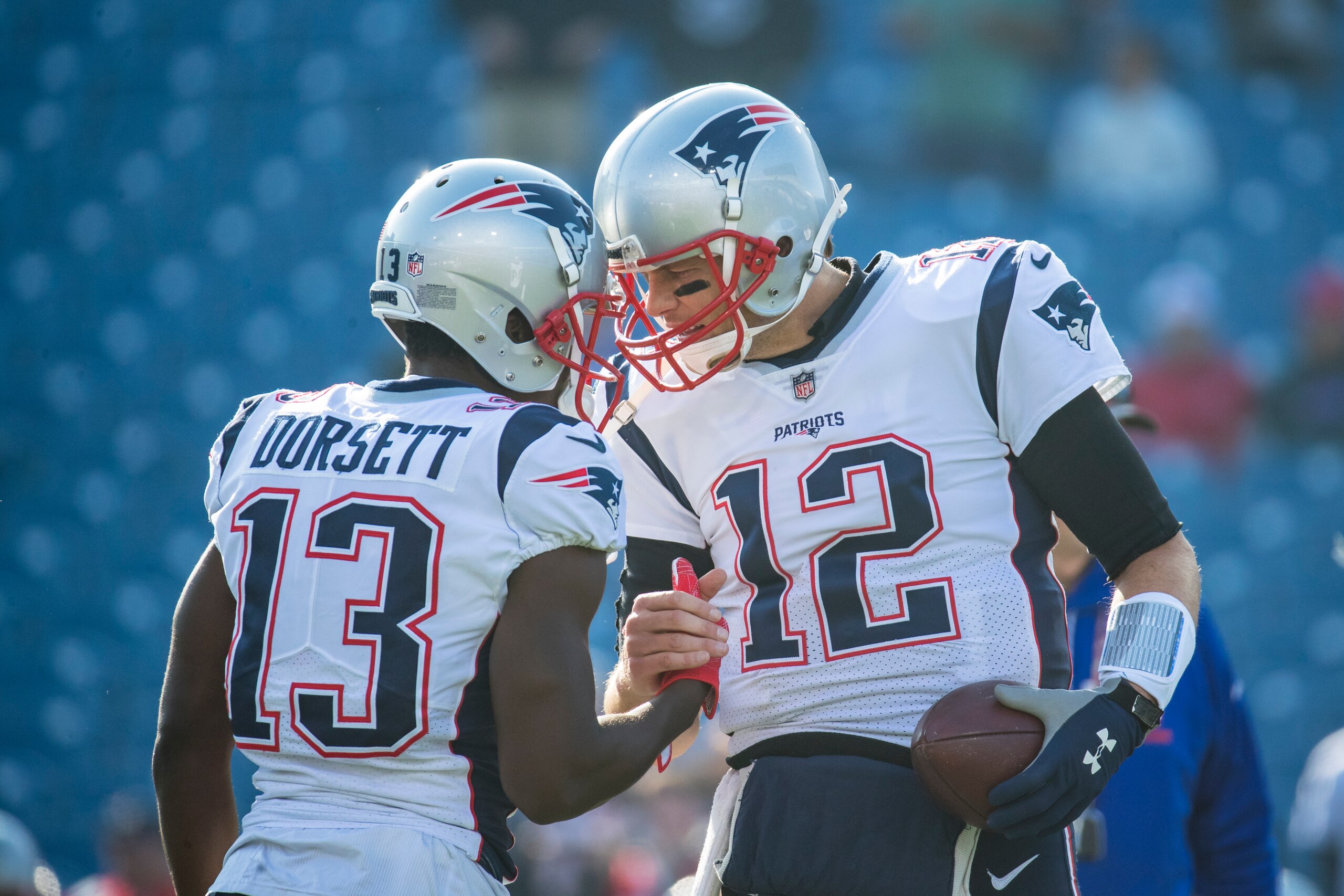 ORCHARD PARK, NY - DECEMBER 03:  Phillip Dorsett #13 shakes hands with Tom Brady #12 of the New England Patriots before the game against the Buffalo Bills at New Era Field on December 3, 2017 in Orchard Park, New York. New England defeats Buffalo 23-3.  (