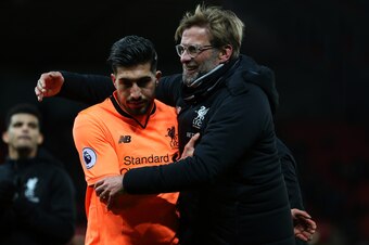STOKE ON TRENT, ENGLAND - NOVEMBER 29: Jurgen Klopp the head coach / manager of Liverpool embraces Emre Can of Liverpool at full time after the Premier League match between Stoke City and Liverpool at Bet365 Stadium on November 29, 2017 in Stoke on Trent,