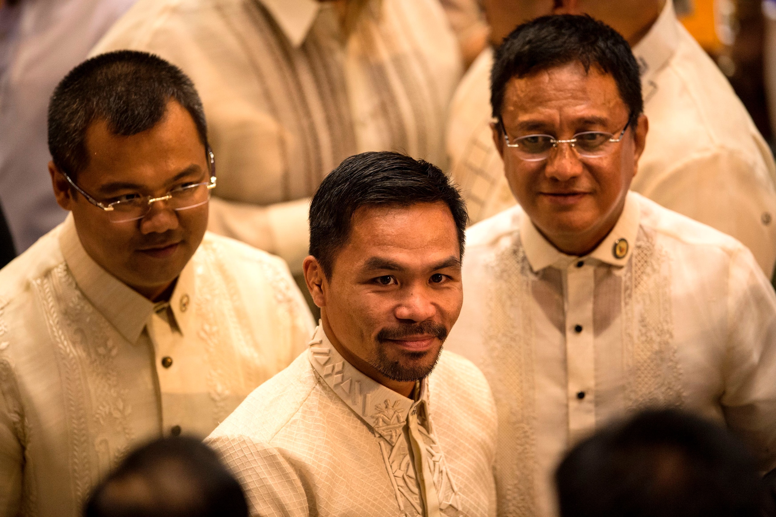 Philippine boxing icon and Senator Manny Pacquiao (C) arrives at the House of Representatives in Manila on July 24, 2017, to attend Philippine President Rodrigo Duterte's second annual state of the nation address.
Duterte was to deliver his annual address Philippine boxing icon and Senator Manny Pacquiao (C) arrives at the House of Representatives in Manila on July 24, 2017, to attend Philippine President Rodrigo Duterte's second annual state of the nation address.
Duterte was to deliver his annual address
