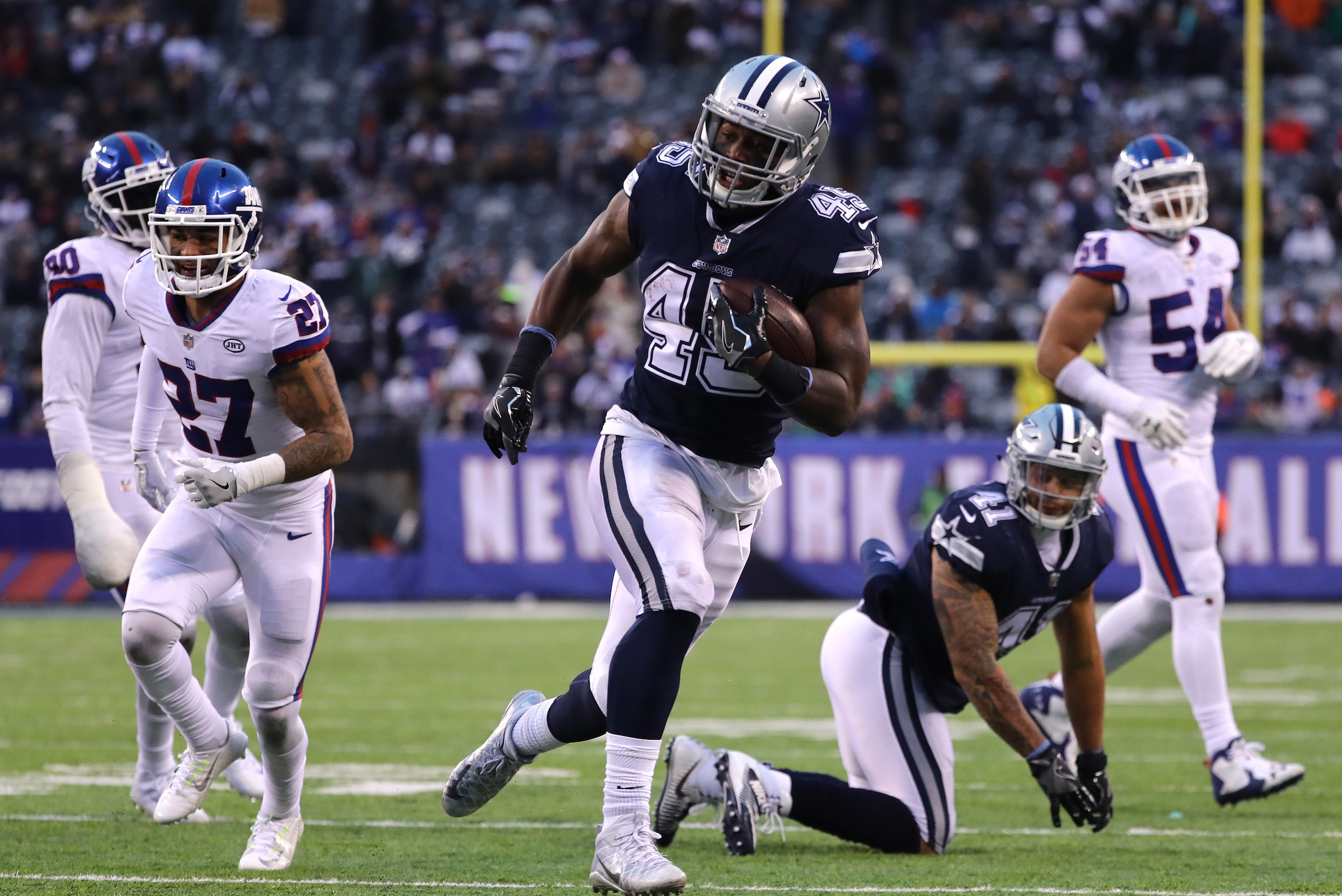 EAST RUTHERFORD, NEW JERSEY - DECEMBER 10:  Rod Smith #45 of the Dallas Cowboys scores a touchdown against the New York Giants during the fourth quarter in the game at MetLife Stadium on December 10, 2017 in East Rutherford, New Jersey. (Photo by Elsa/Get