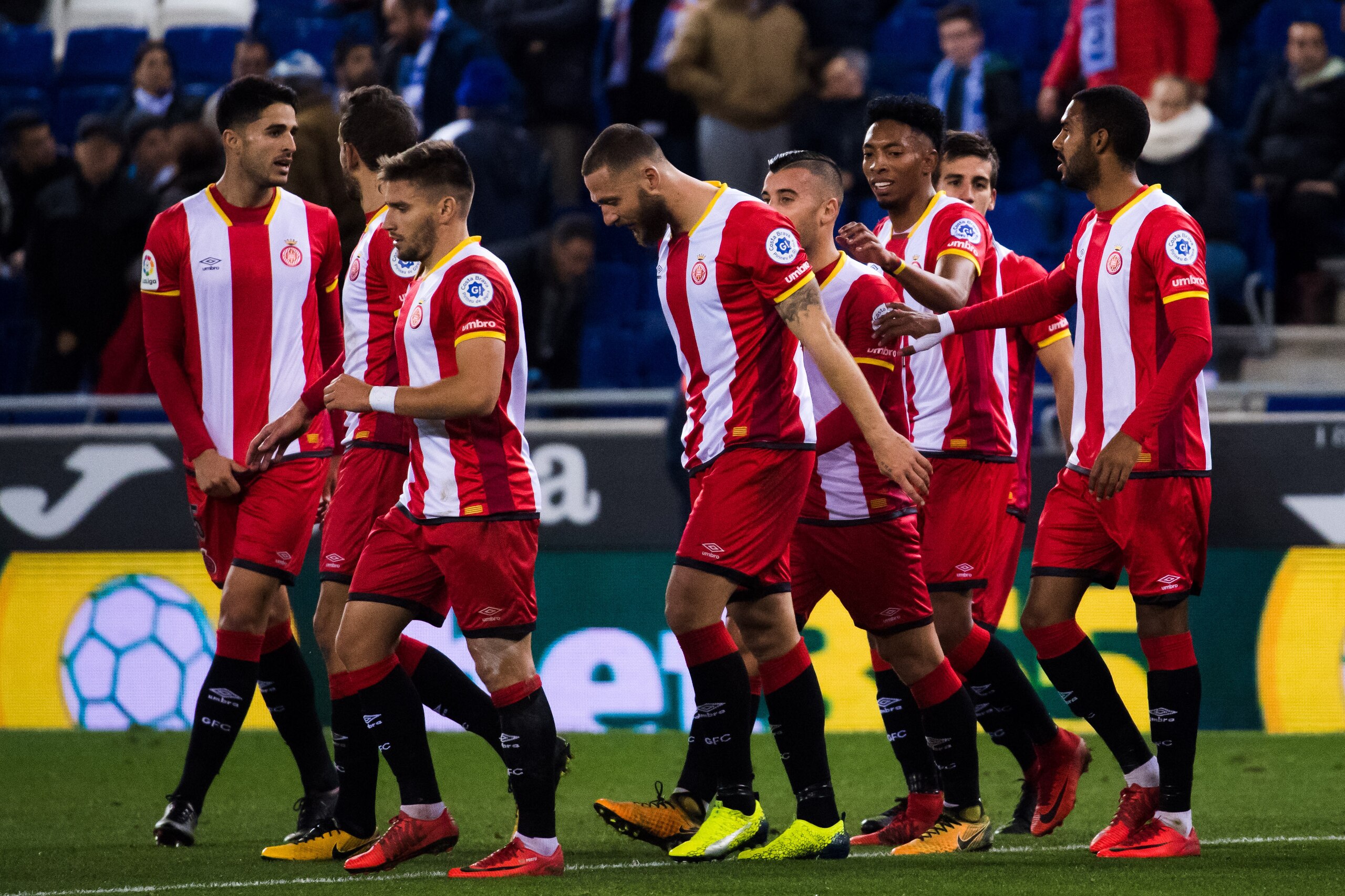 BARCELONA, SPAIN - DECEMBER 11: Players of Girona FC celebrate after their teammate David Timor scored the opening goal during the La Liga match between RCD Espanyol and Girona FC at RCDE Stadium on December 11, 2017 in Barcelona, Spain. (Photo by Alex BARCELONA, SPAIN - DECEMBER 11: Players of Girona FC celebrate after their teammate David Timor scored the opening goal during the La Liga match between RCD Espanyol and Girona FC at RCDE Stadium on December 11, 2017 in Barcelona, Spain. (Photo by Alex