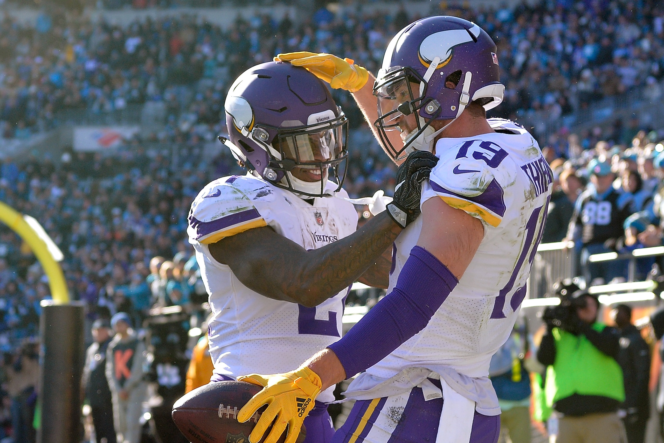 CHARLOTTE, NC - DECEMBER 10:  Adam Thielen #19 celebrates with Jerick McKinnon #21 of the Minnesota Vikings after scoring a touchdown against the Carolina Panthers during their game at Bank of America Stadium on December 10, 2017 in Charlotte, North Carol