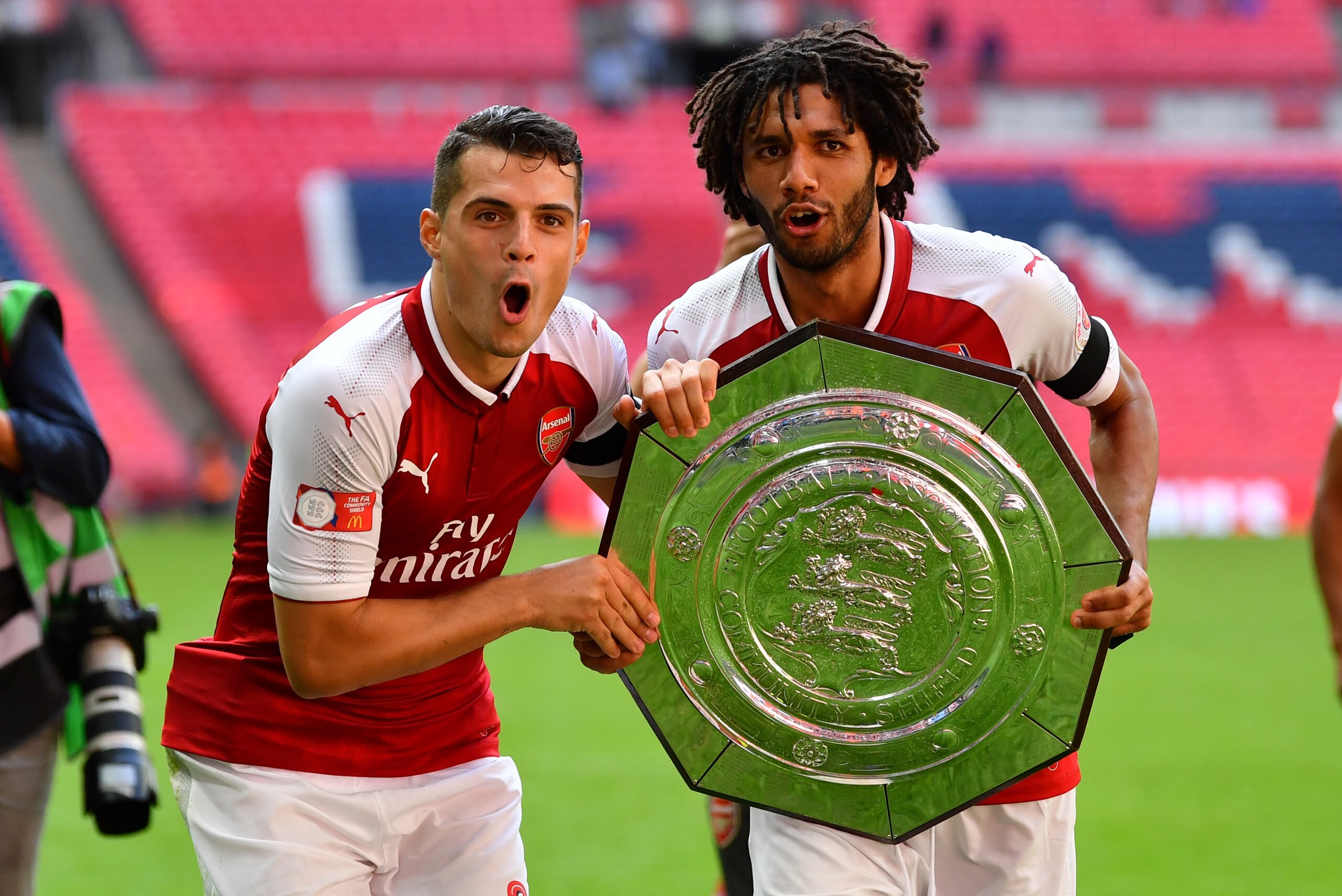 LONDON, ENGLAND - AUGUST 06:  Granit Xhaka of Arsenal and Mohamed Elneny of Arsenal celebrate with the trophy following the The FA Community Shield final between Chelsea and Arsenal at Wembley Stadium on August 6, 2017 in London, England.  (Photo by Dan M