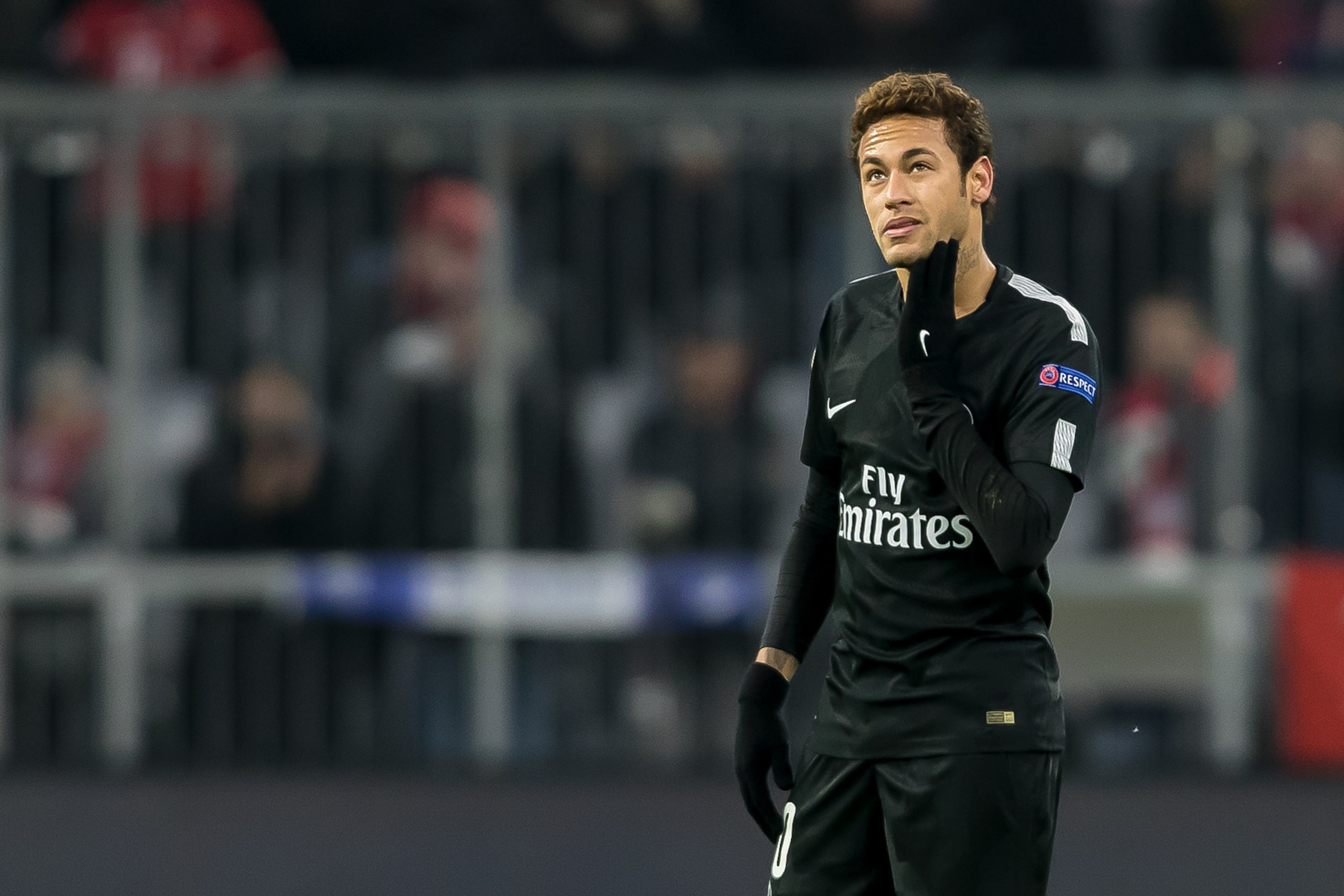 MUNICH, GERMANY - DECEMBER 05: Neymar of Paris Saint-Germain looks on during the UEFA Champions League group B match between Bayern Muenchen and Paris Saint-Germain at Allianz Arena on December 5, 2017 in Munich, Germany. (Photo by TF-Images/TF-Images via