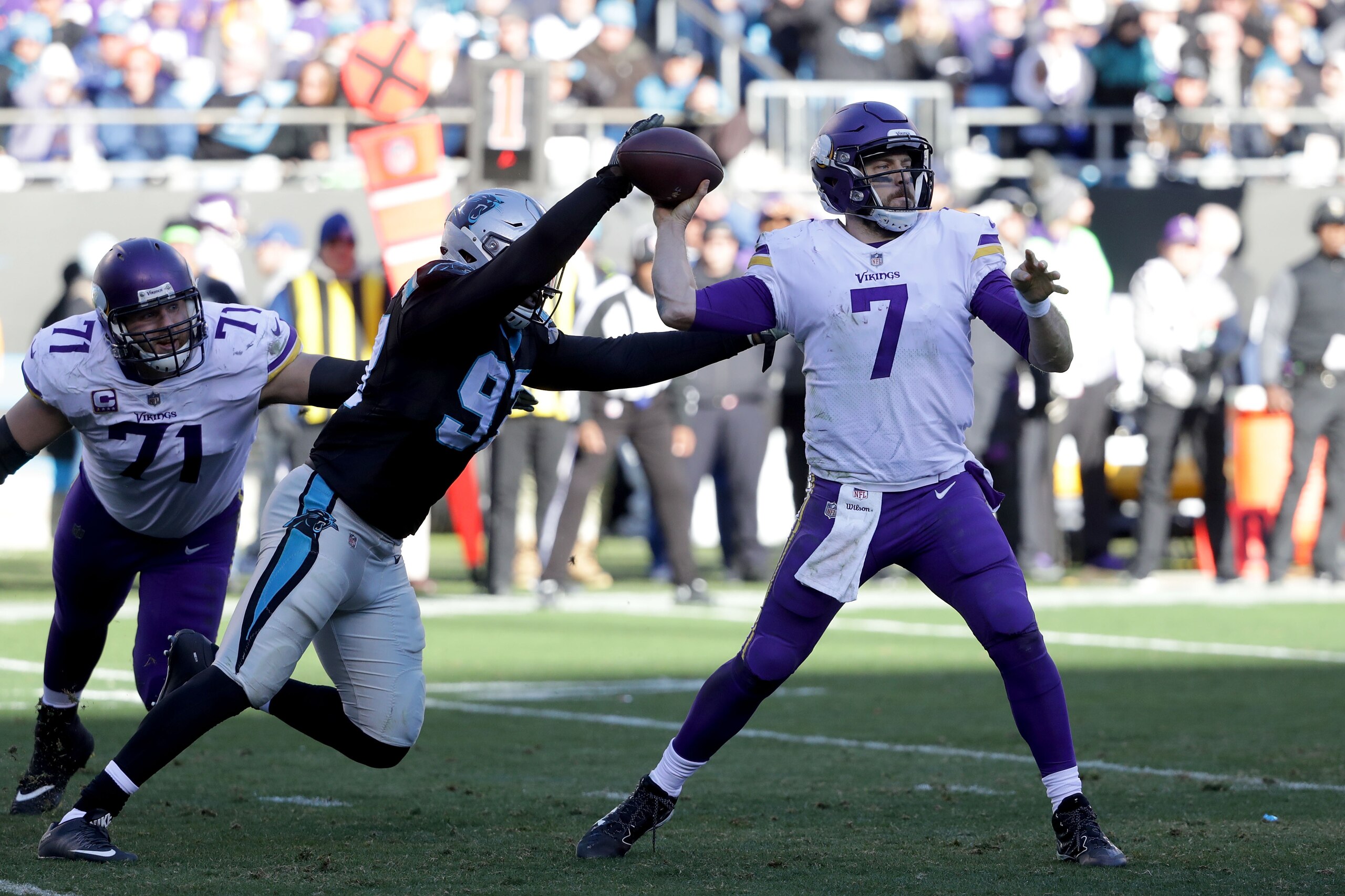 CHARLOTTE, NC - DECEMBER 10:  Mario Addison #97 of the Carolina Panthers strips the ball from Case Keenum #7 of the Minnesota Vikings in the third quarter during their game at Bank of America Stadium on December 10, 2017 in Charlotte, North Carolina.  (Ph