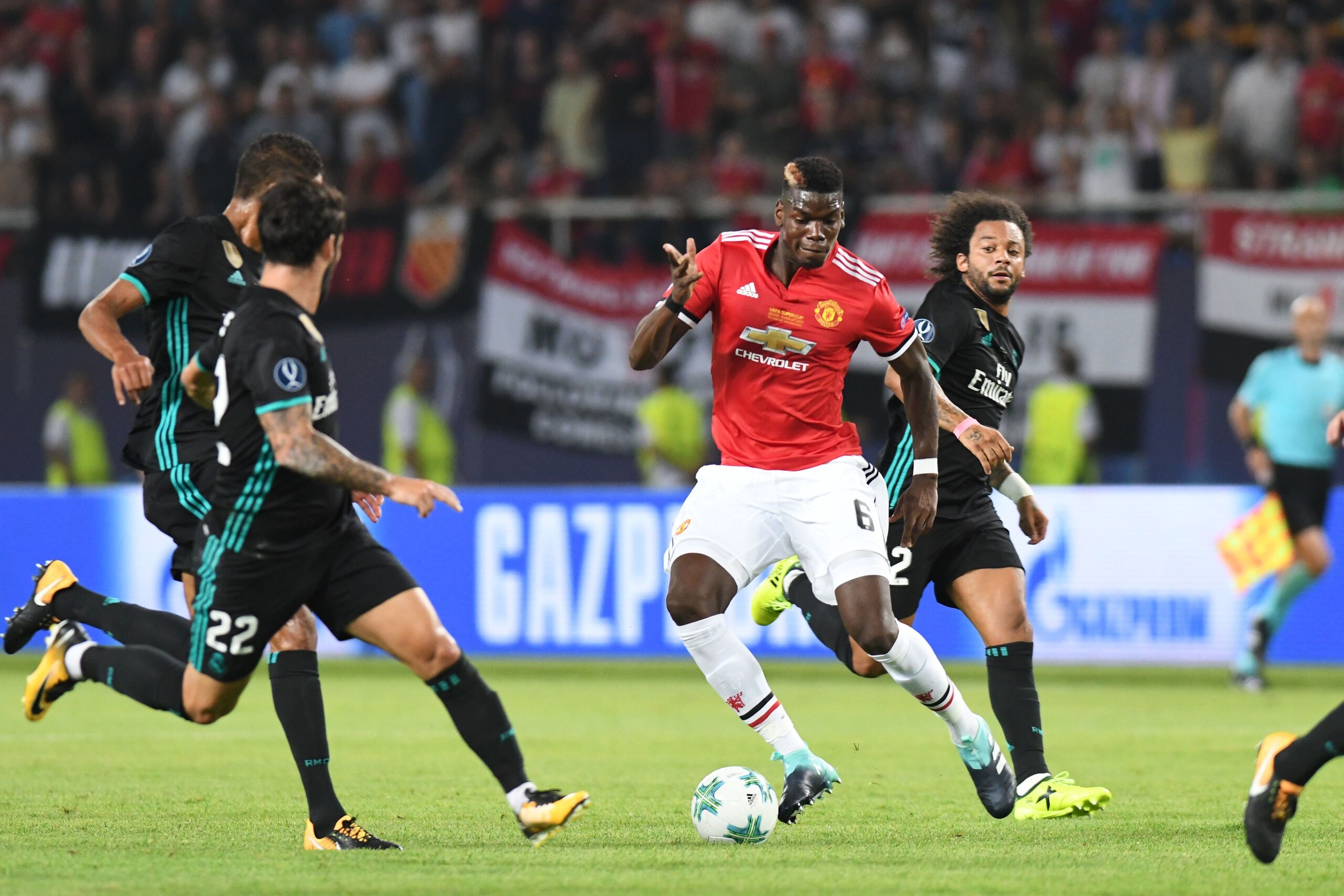 Manchester United's French midfielder Paul Pogba (2nd-R) drives the ball during the UEFA Super Cup football match between Real Madrid and Manchester United on August 8, 2017, at the Philip II Arena in Skopje. / AFP PHOTO / Robert ATANASOVSKI        (Photo