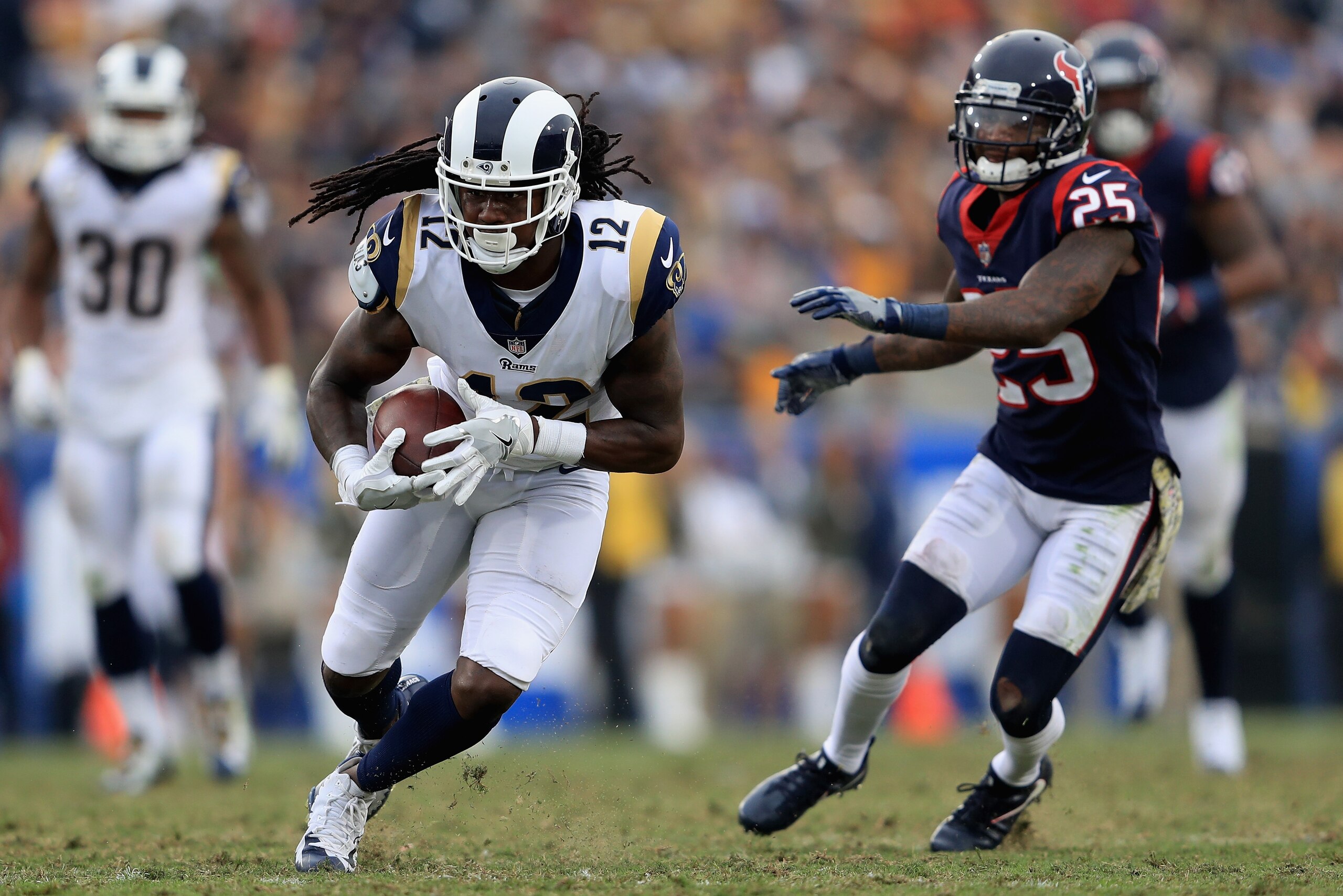 LOS ANGELES, CA - NOVEMBER 12:   Sammy Watkins #12 of the Los Angeles Rams runs past  Kareem Jackson #25 of the Houston Texans during the first half of game at Los Angeles Memorial Coliseum on November 12, 2017 in Los Angeles, California.  (Photo by Sean 