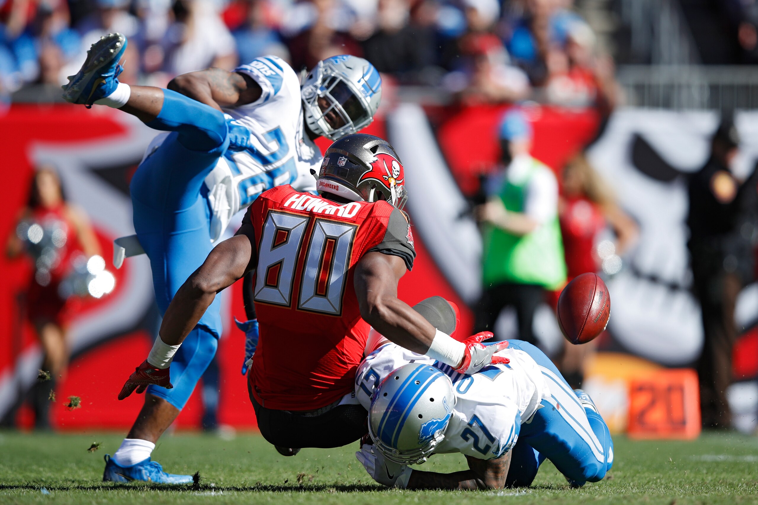 TAMPA, FL - DECEMBER 10: Glover Quin #27 of the Detroit Lions causes a fumble after a hit against O.J. Howard #80 of the Tampa Bay Buccaneers in the first quarter of a game at Raymond James Stadium on December 10, 2017 in Tampa, Florida. (Photo by Joe Rob