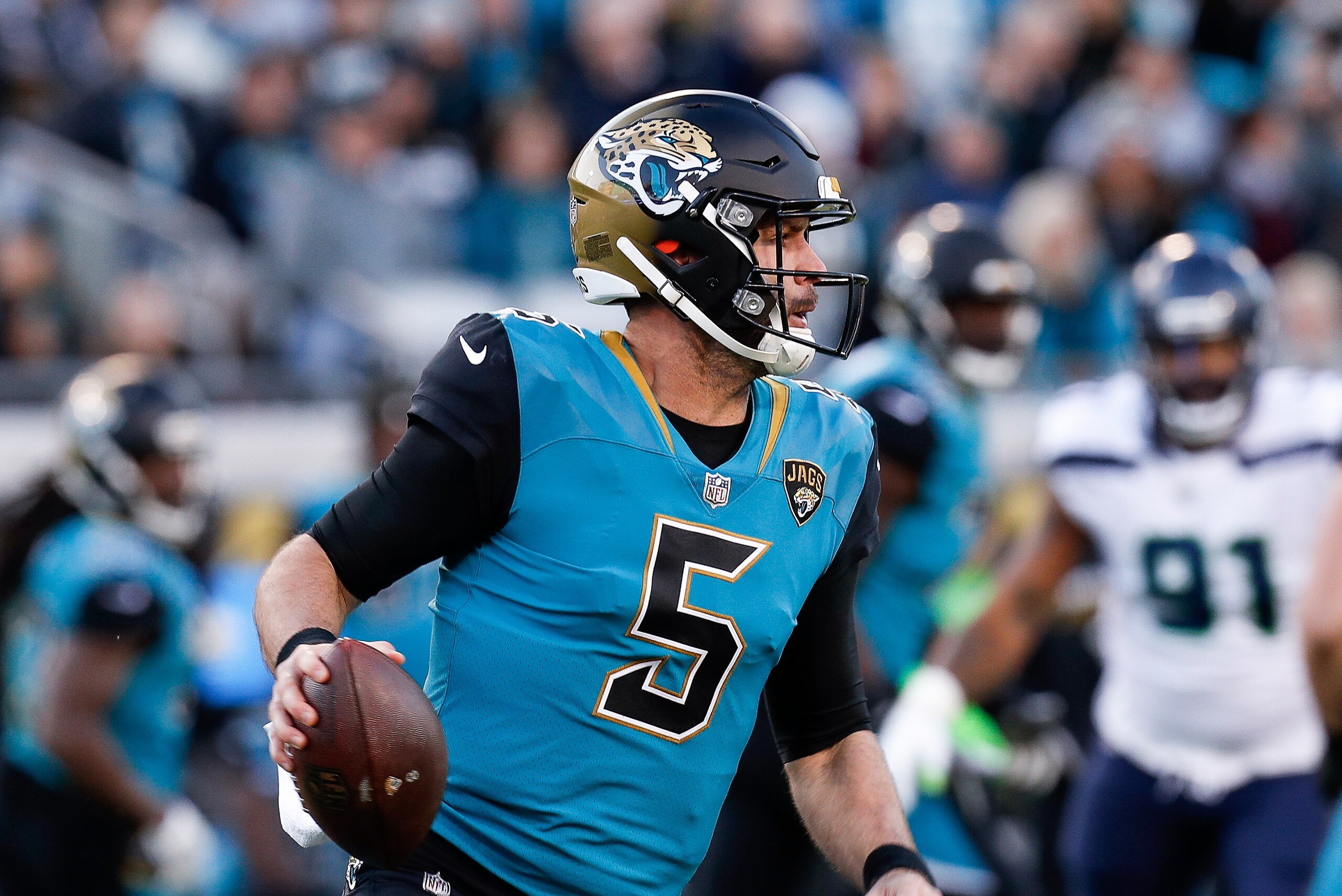 JACKSONVILLE, FL - DECEMBER 10: Quarterback Blake Bortles #5 of the Jacksonville Jaguars on a passing play during the game against the Seattle Seahawks at EverBank Field on December 10, 2017 in Jacksonville, Florida. The Jaguars defeated the Seahawks 30 t