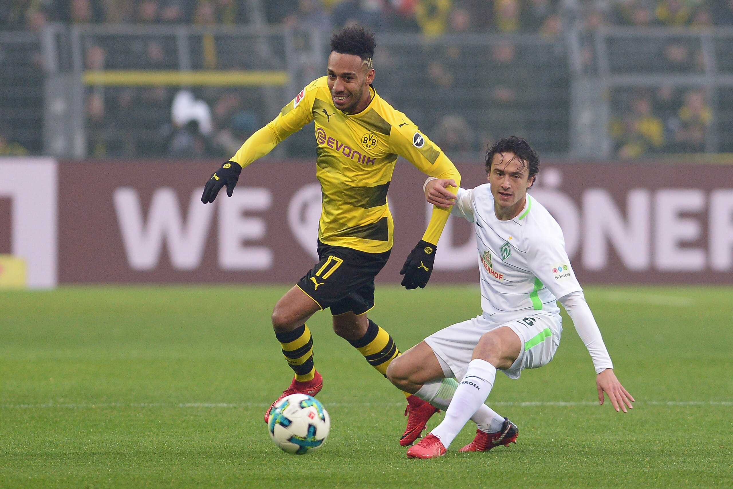 DORTMUND, GERMANY - DECEMBER 09: Auba, Pierre-Emerick Aubameyang of Dortmund and Thomas Delaney of Bremen battle for the ball during the Bundesliga match between Borussia Dortmund and SV Werder Bremen at Signal Iduna Park on December 9, 2017 in Dortmund, DORTMUND, GERMANY - DECEMBER 09: Auba, Pierre-Emerick Aubameyang of Dortmund and Thomas Delaney of Bremen battle for the ball during the Bundesliga match between Borussia Dortmund and SV Werder Bremen at Signal Iduna Park on December 9, 2017 in Dortmund,